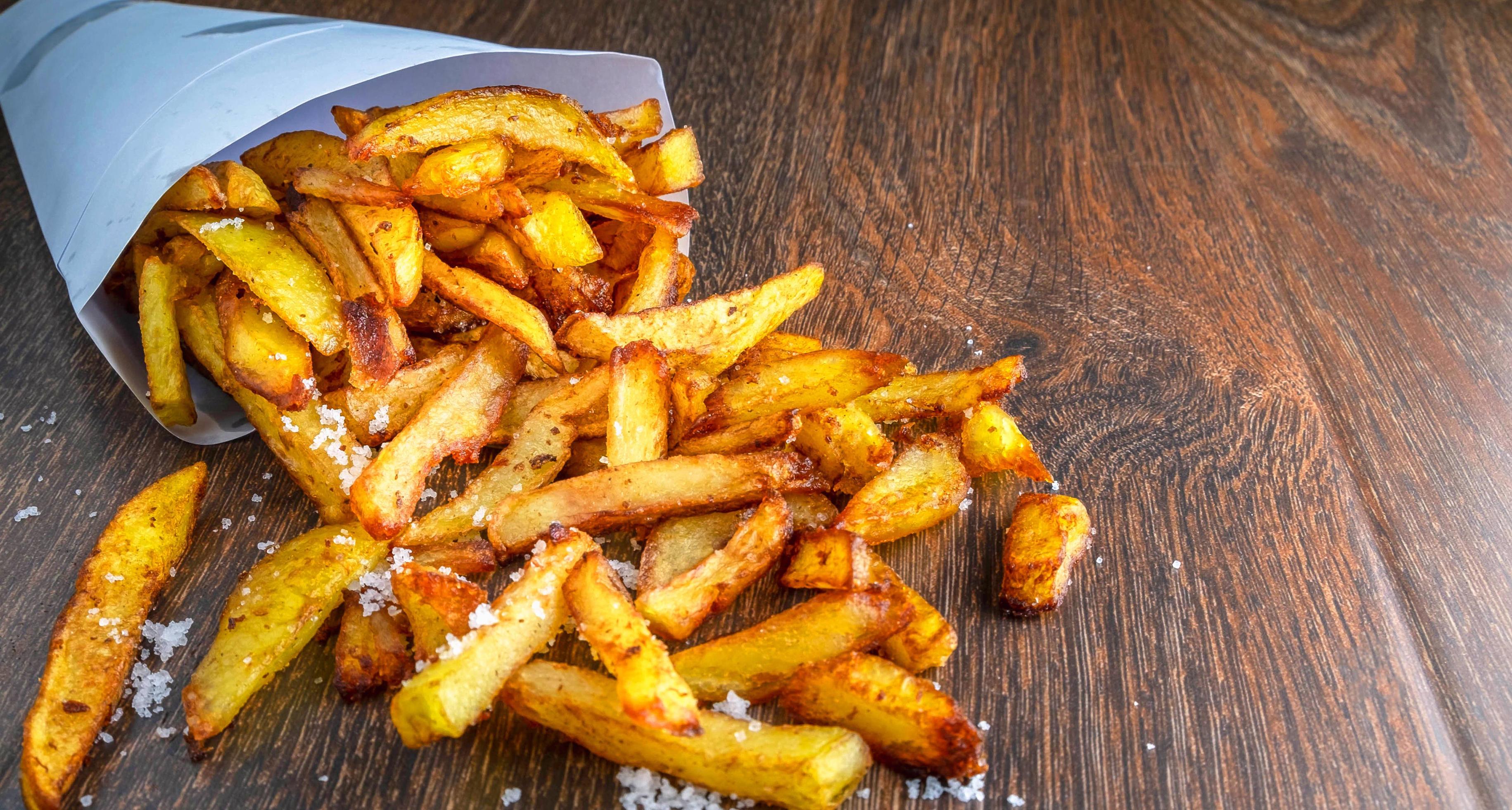 Menu fast food of French fries or fried potatoes homemade on wooden background.top view Stock Free