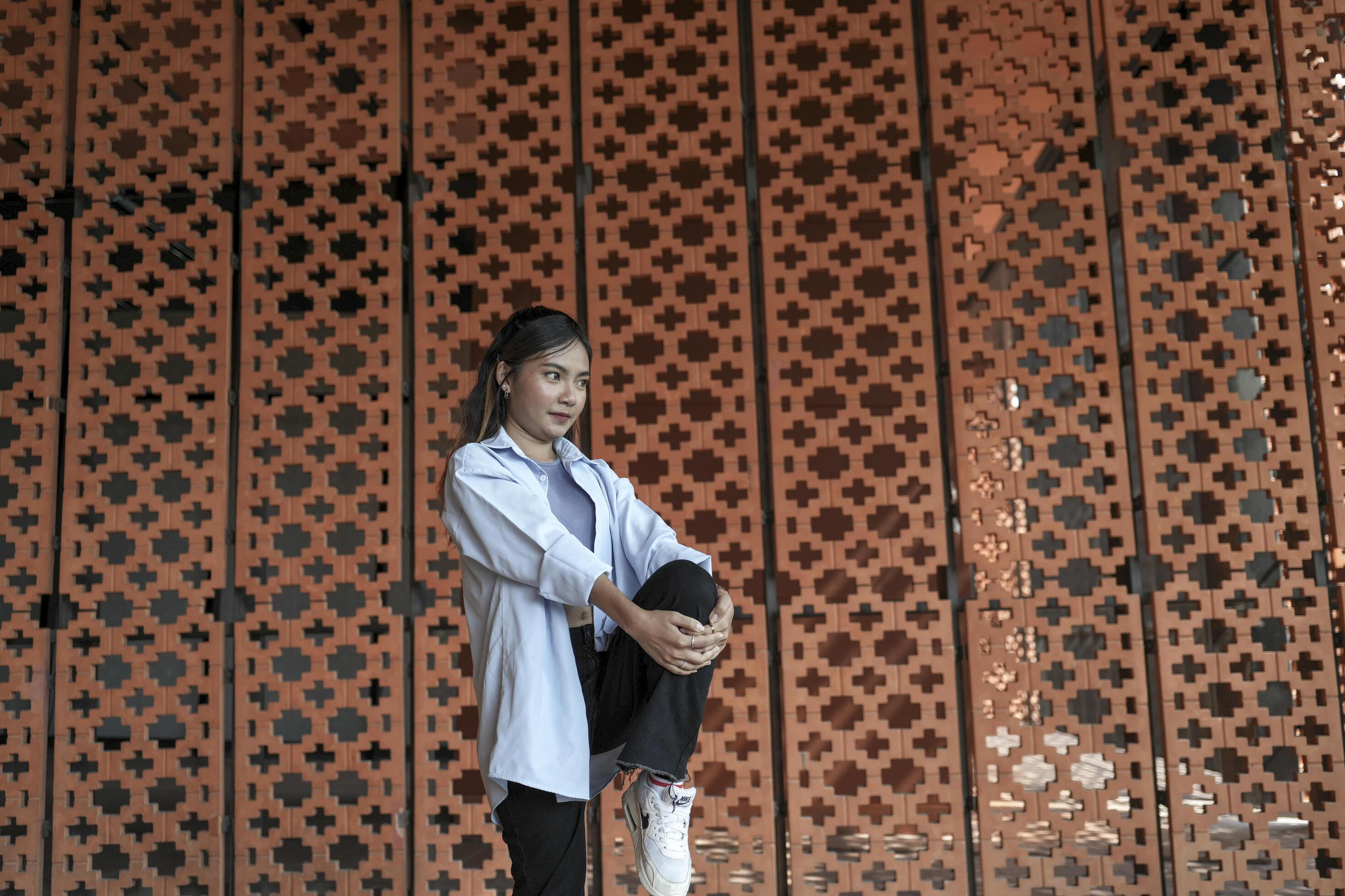 Asian women do freestyle hip hop and breakdancing in a public space in the middle of the city. With a cheerful and happy attitude Stock Free