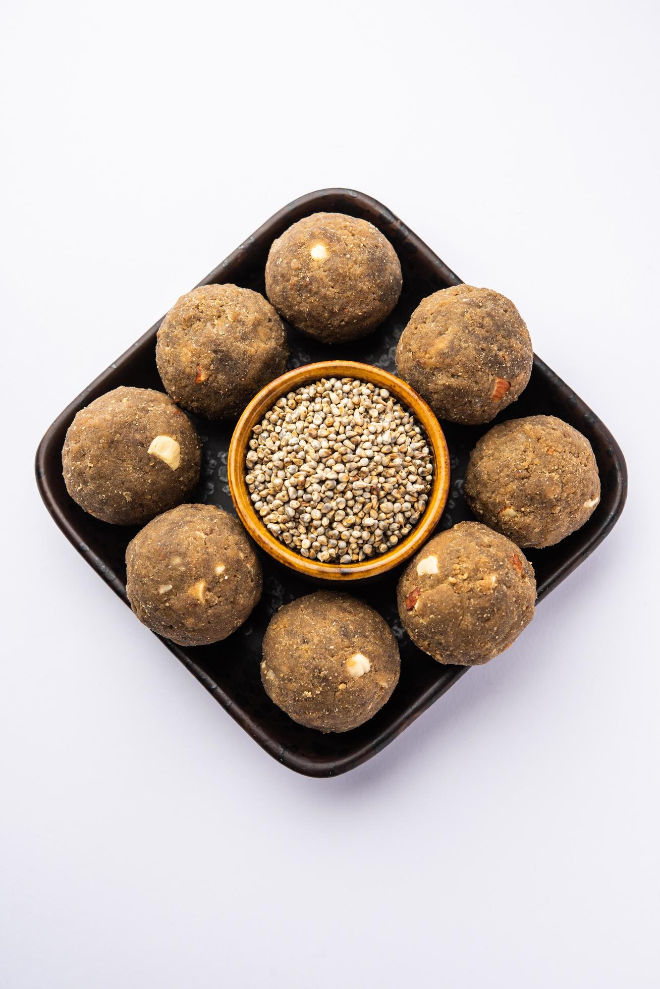 Bajra Atta Ladoo or kuler laddoo – Millet Flour Laddu, a popular winter sweet snack food from India Stock Free