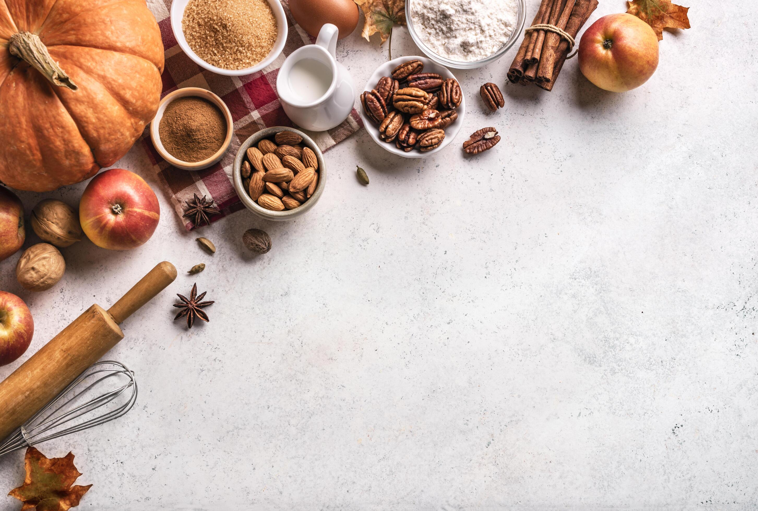 Autumn baking background with pumpkins, apples and nuts Stock Free