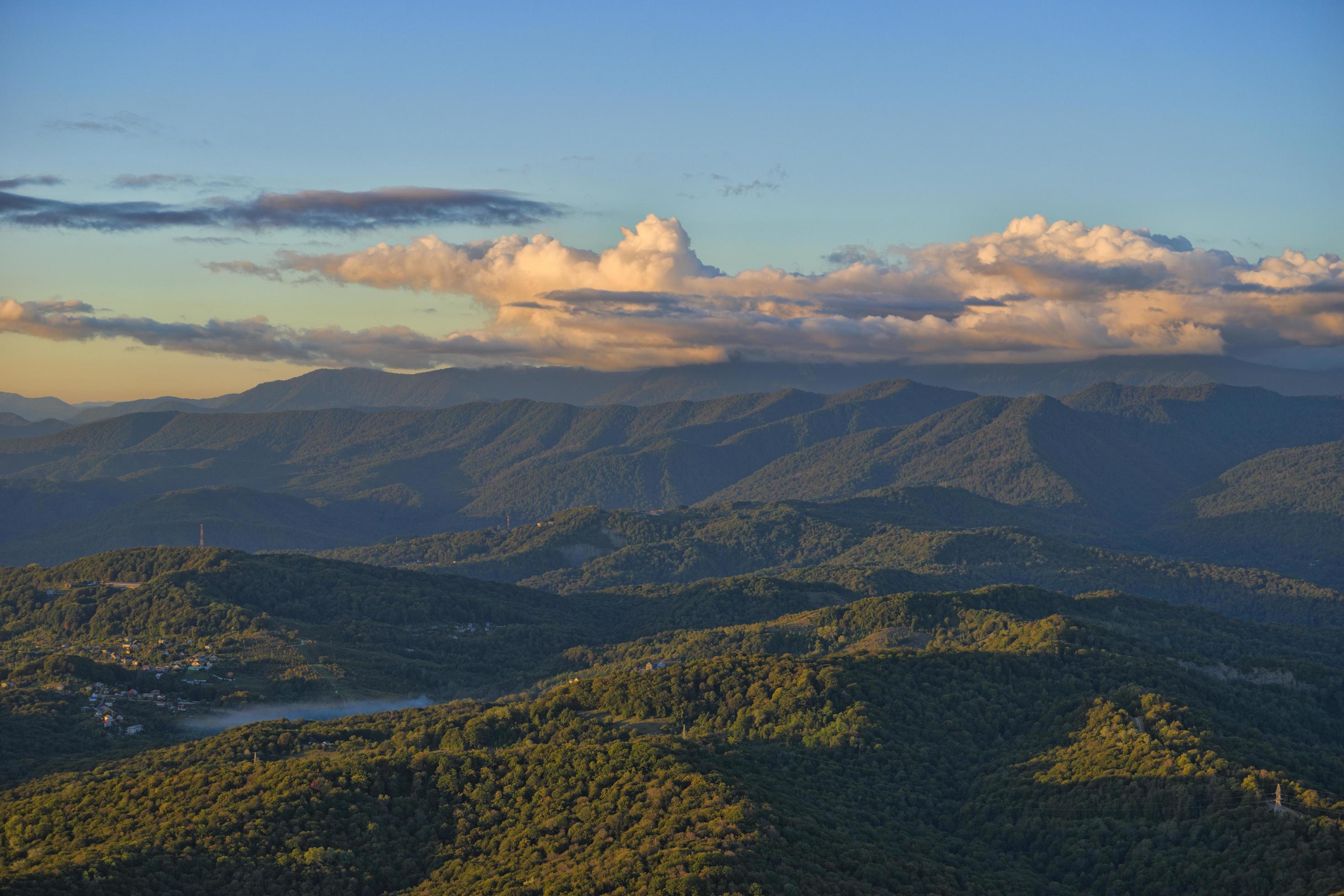 Natural landscape with mountain peaks under the blue sky. Stock Free