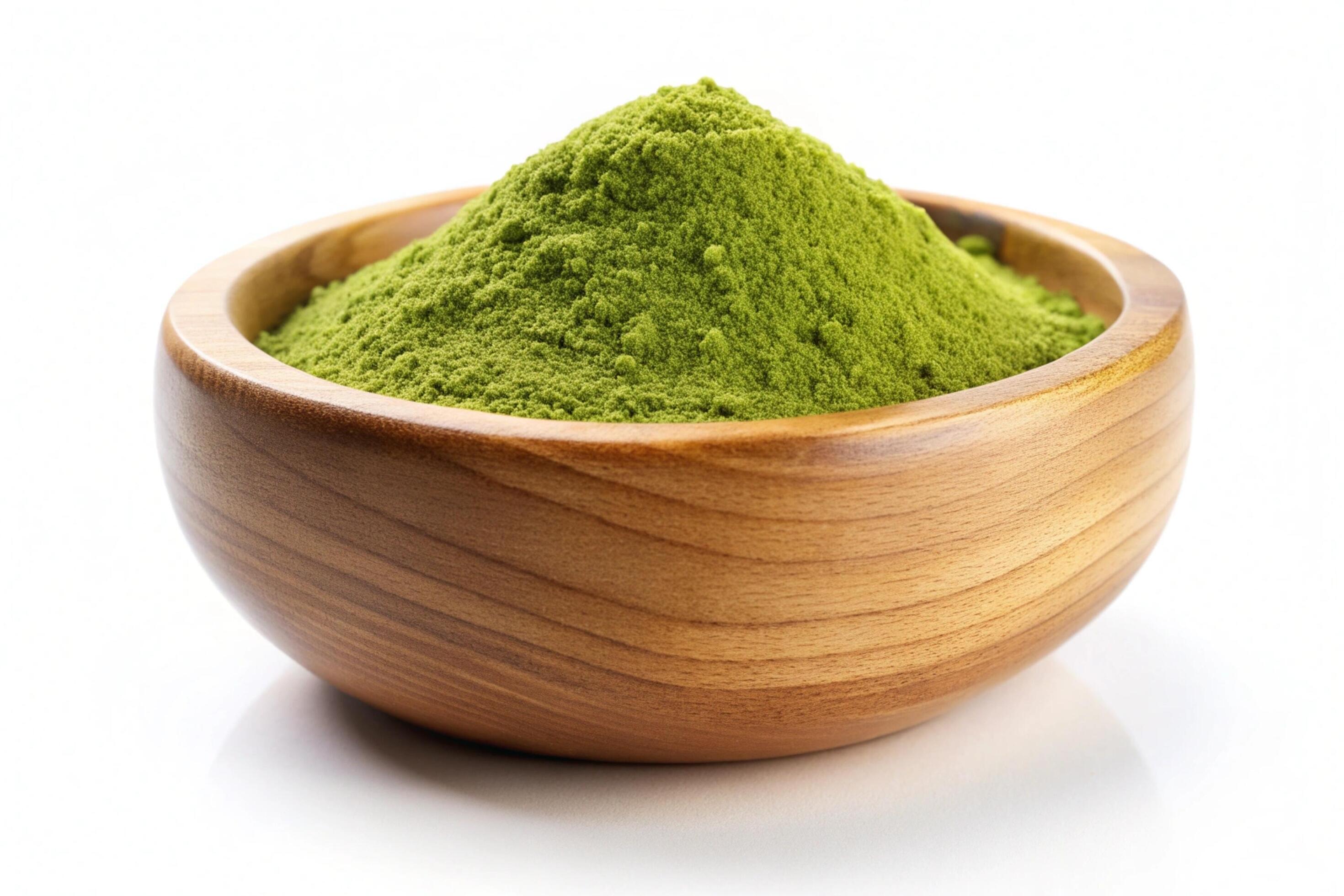 Instant green tea powder in wood bowl isolated on white background Stock Free