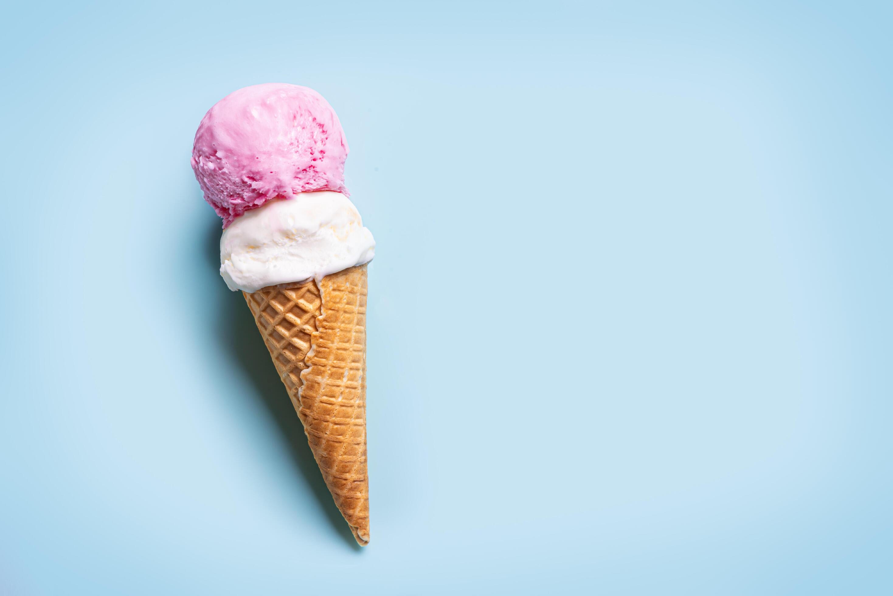 Ice Cream Scoops in Cone on blue background Stock Free