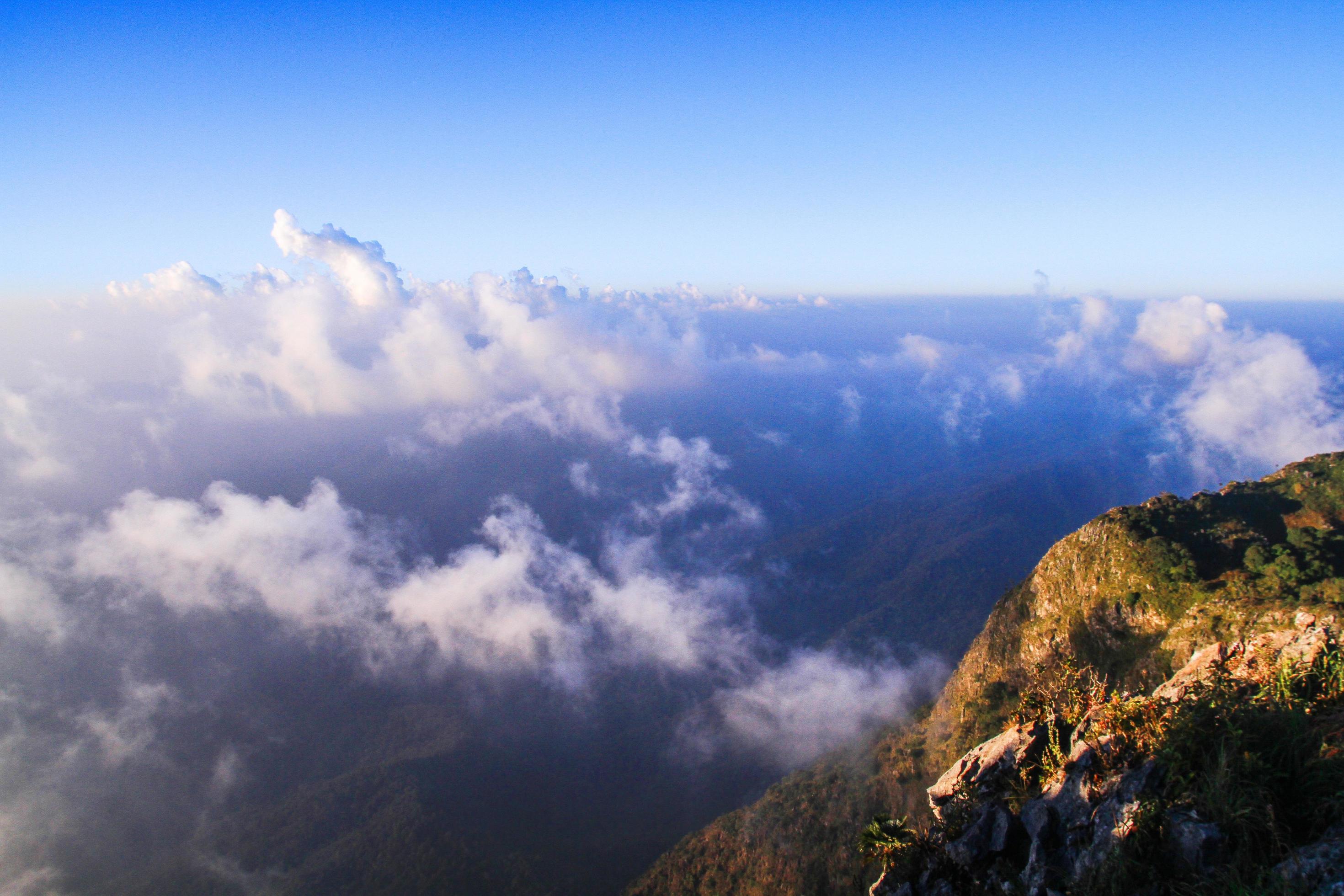 Sunrise in morning with sky and cloud on the mountain. Sunray with Fog and mist cover the jungle hill in Thailand Stock Free