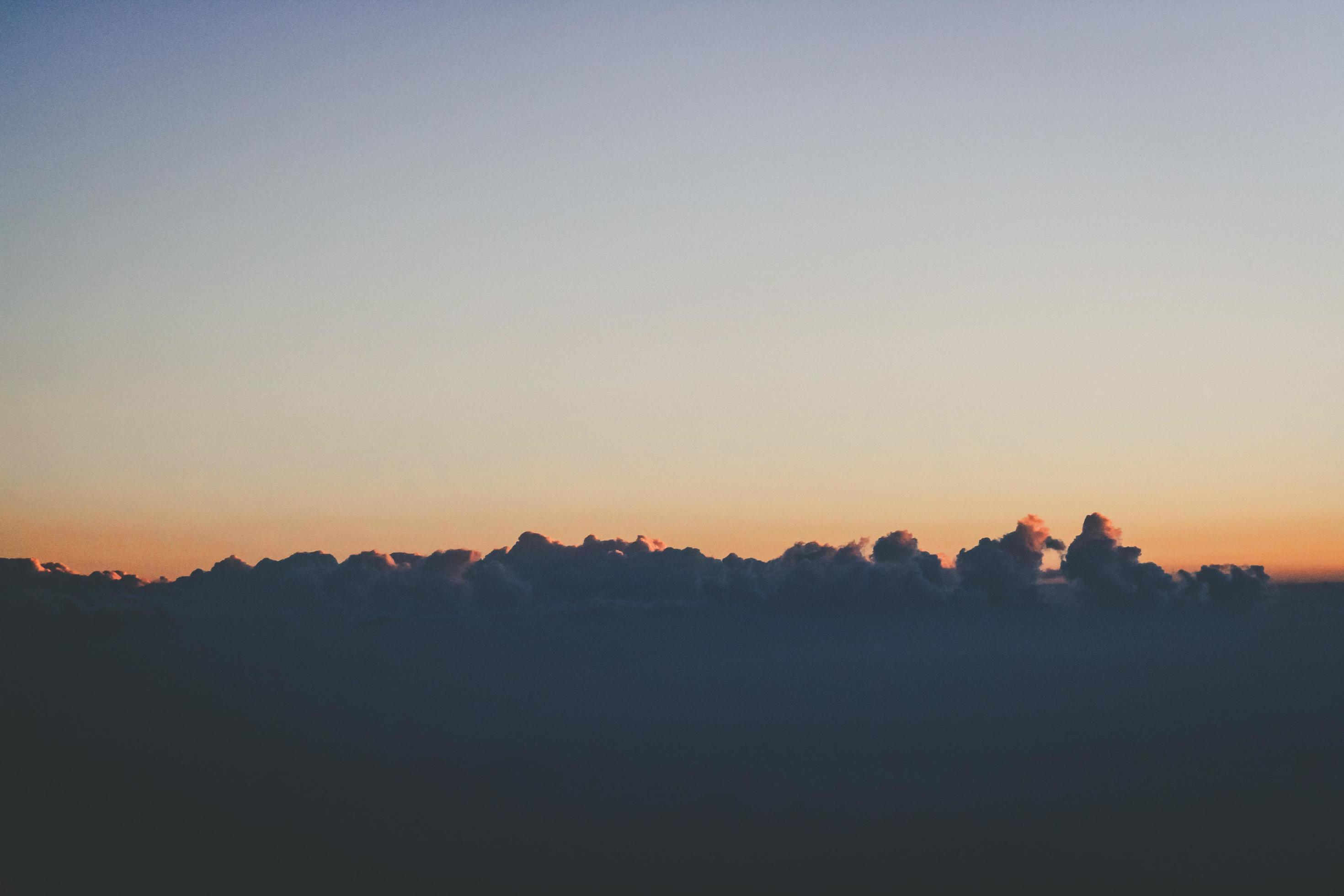 Sunset in sky and cloud, beautiful colorful twilight time with silhouette of mountain. Stock Free