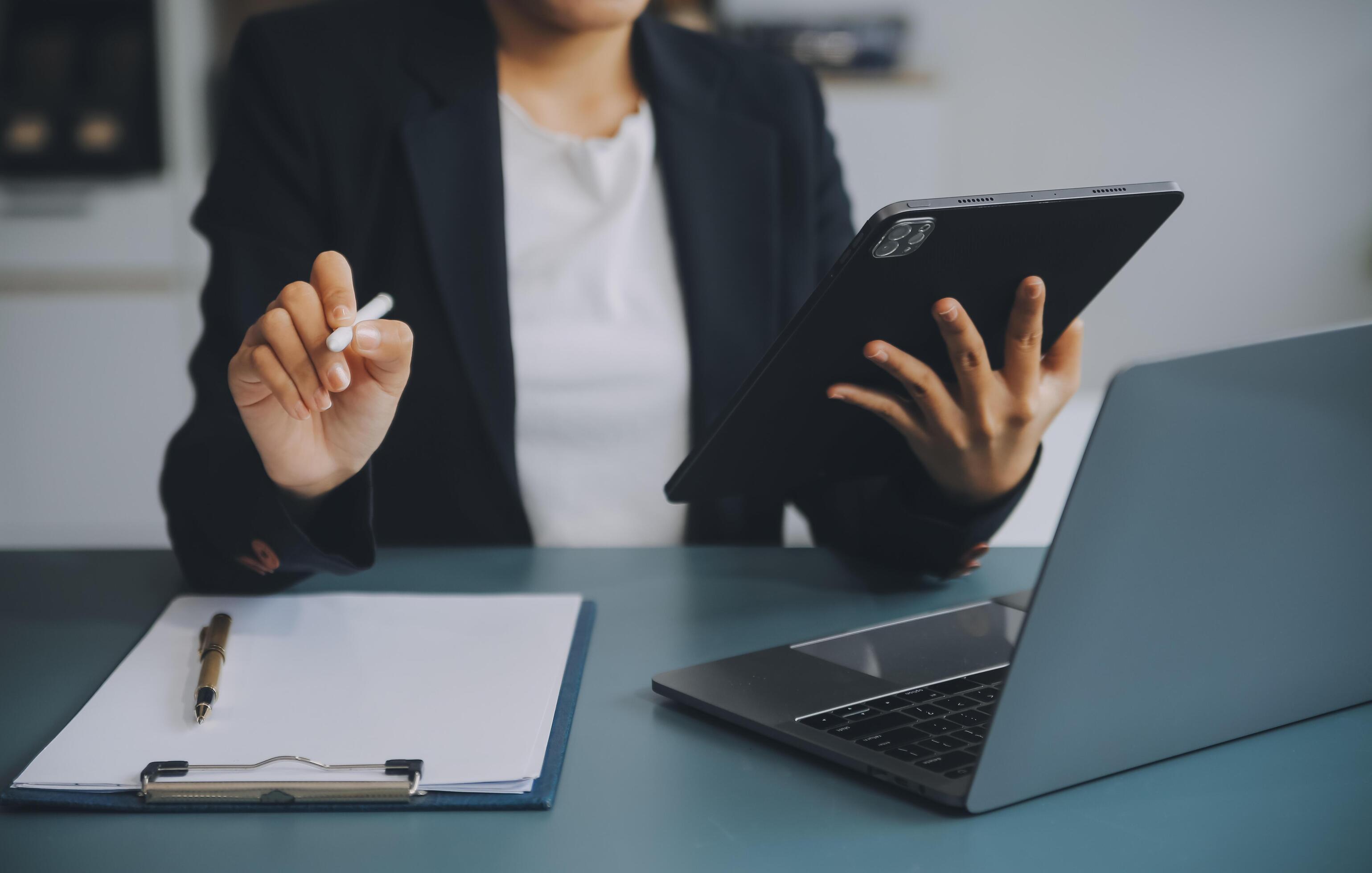 Portrait of a successful business woman using digital tablet Stock Free