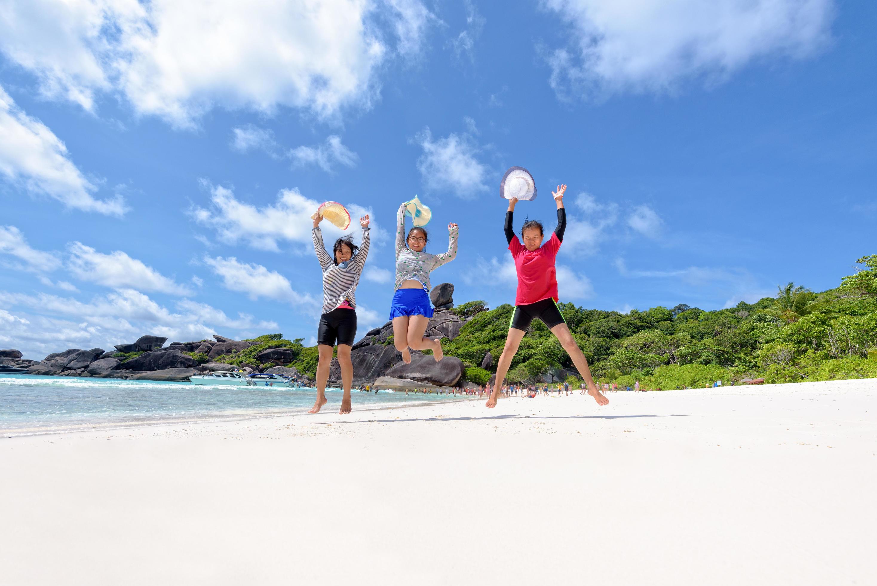 Tourist women three generation family on beach Stock Free