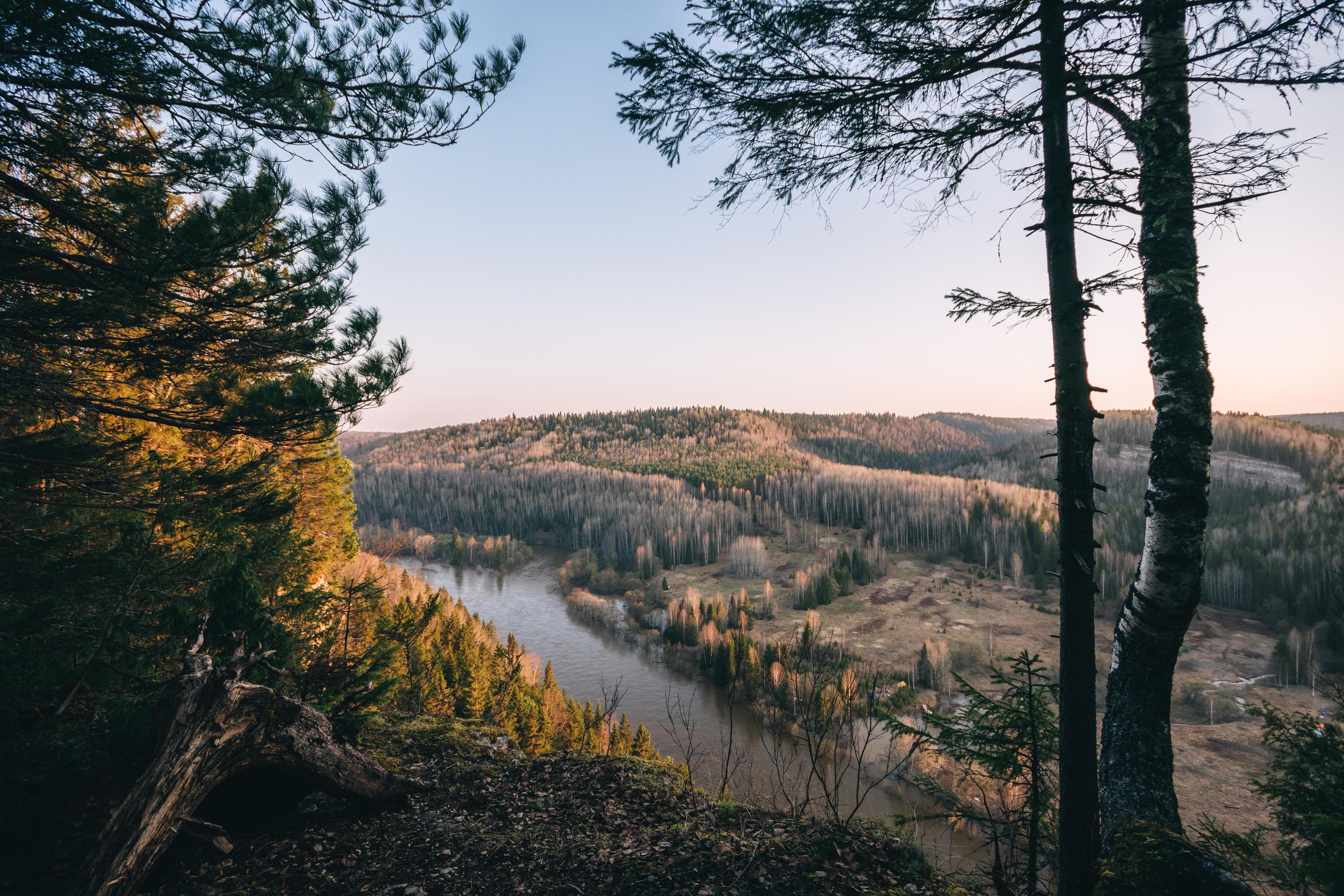 Beautiful morning landscape, first sun rays appears over mountains and river valley, Usva, Ural mountains. Stock Free