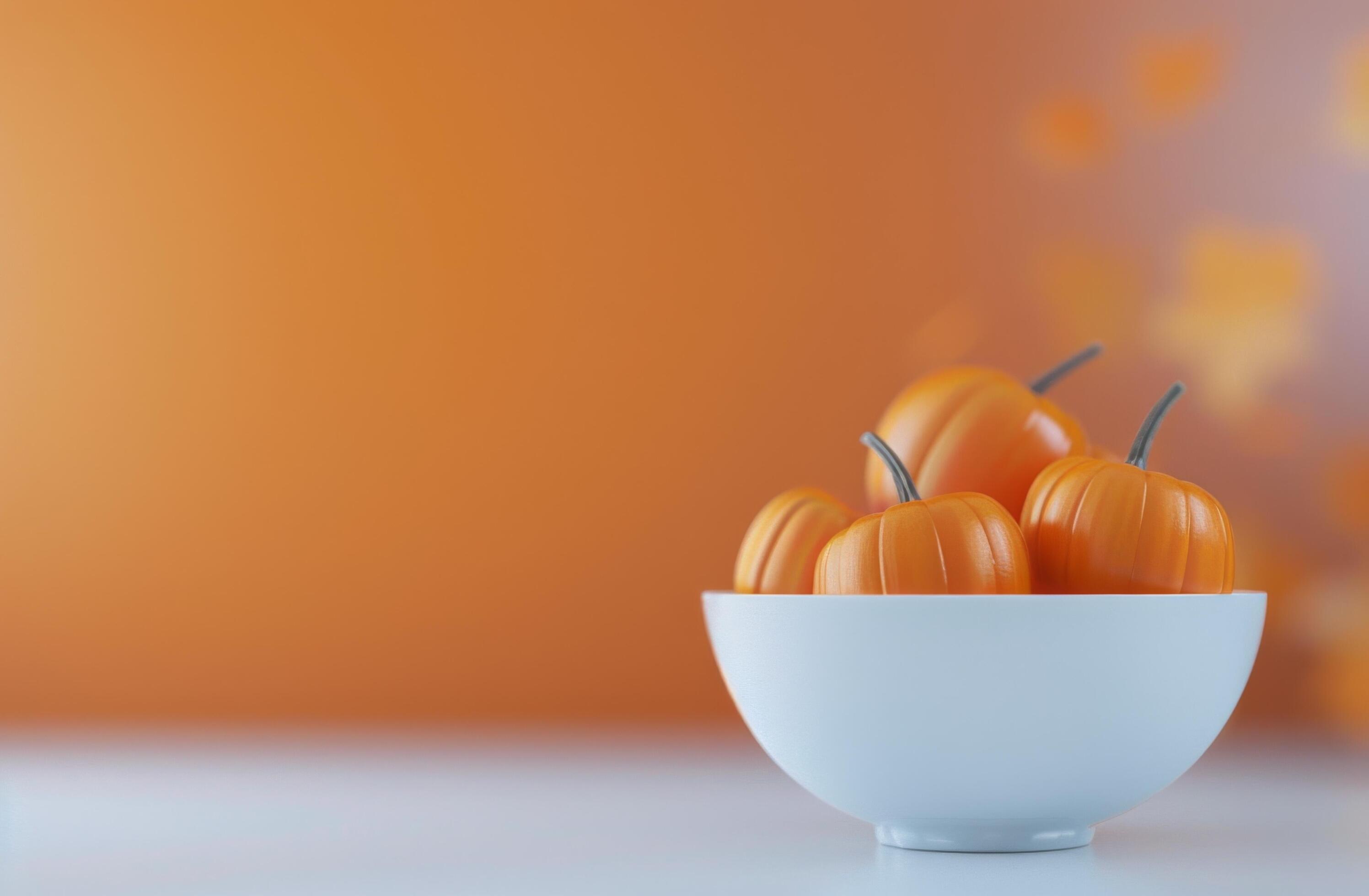 Vibrant Orange Pumpkin With Autumn Leaves on Warm Background Stock Free