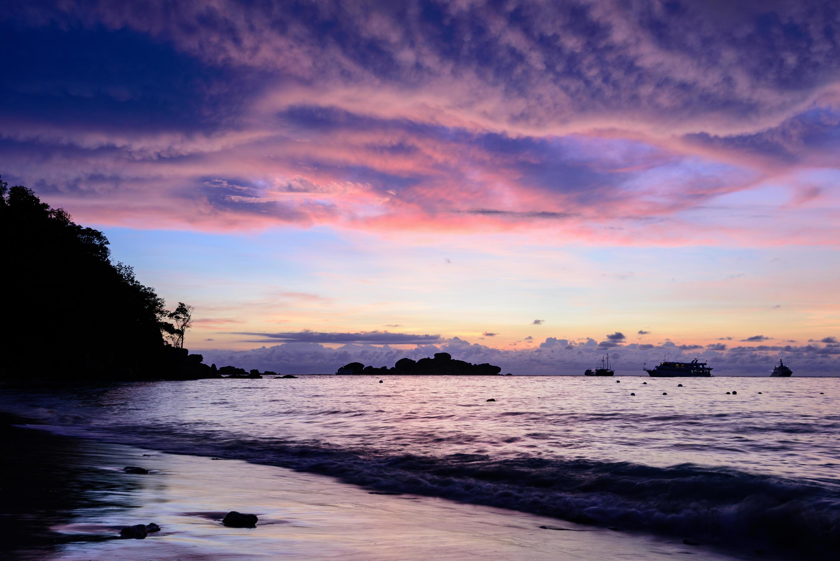 Beautiful cloud and sky at sunrise on the beach Stock Free