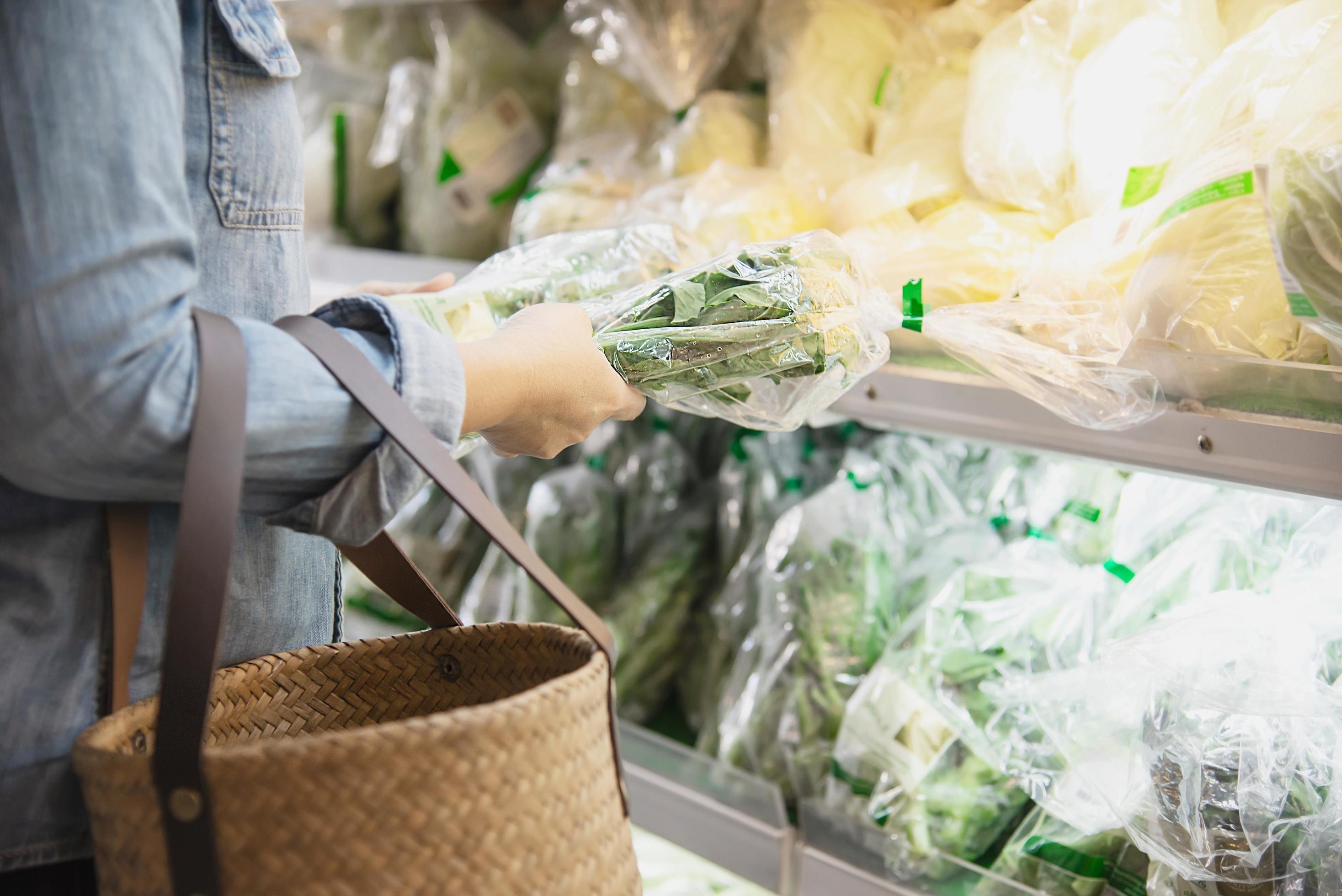 Lady is shopping fresh vegetable in supermarket store – woman in fresh market lifestyle concept Stock Free