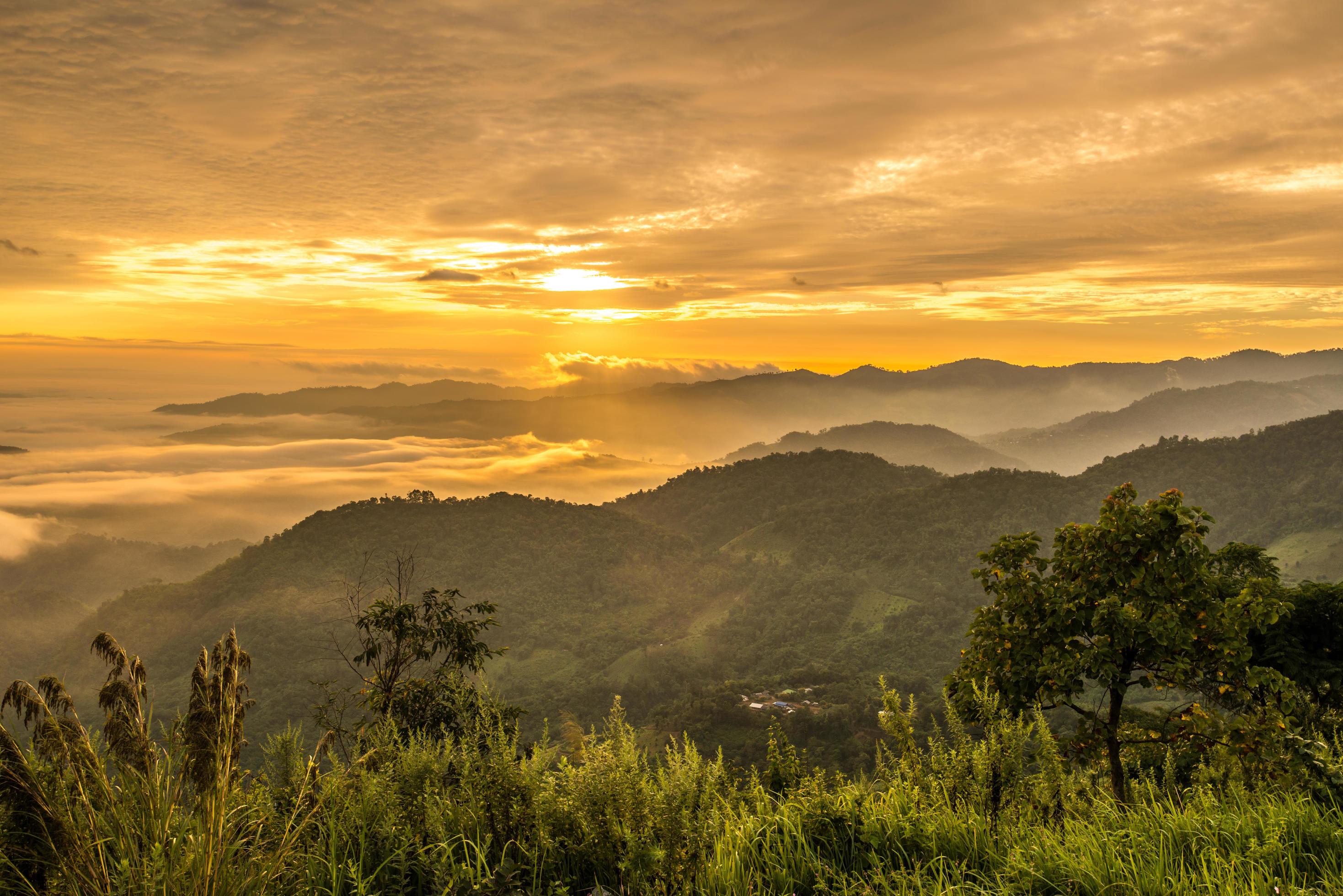 Beautiful sunrise on Doi Kart Phee the remote highland mountains area in Chiang Rai province of Thailand. Stock Free