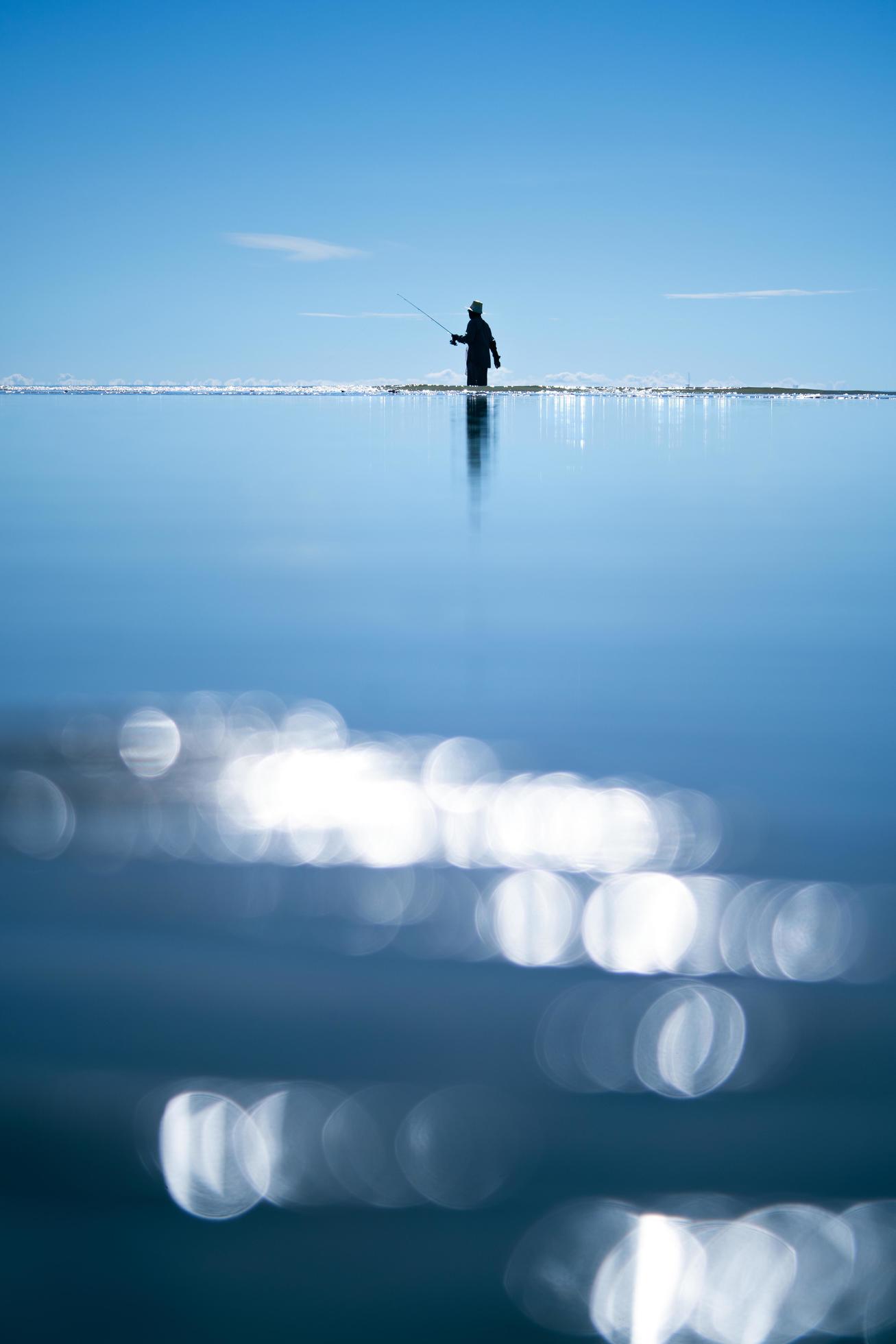 Outdoor local lifestyle of fisherman on the beach sea in the late morning Stock Free