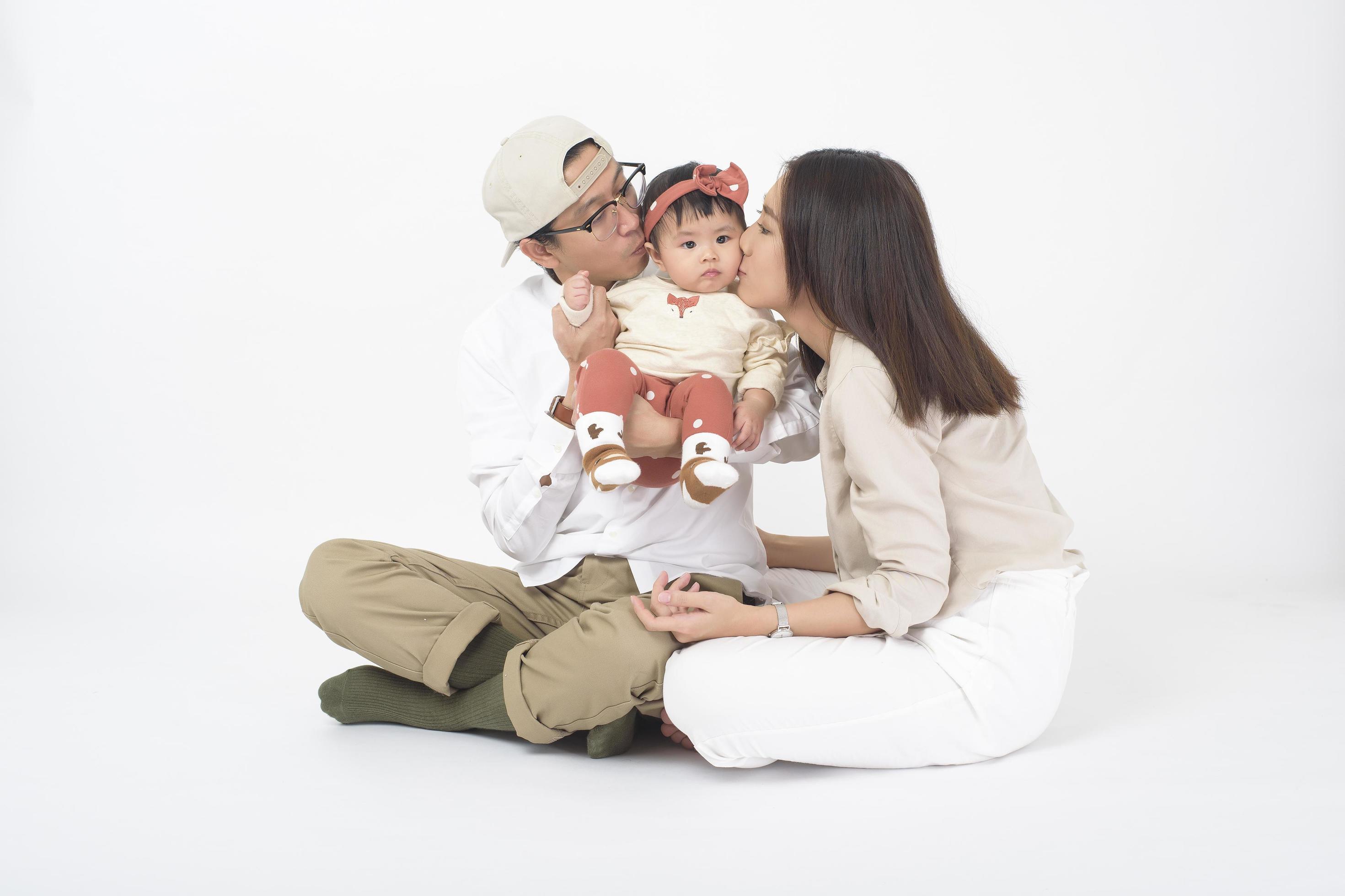 Happy Asian family on white background Stock Free