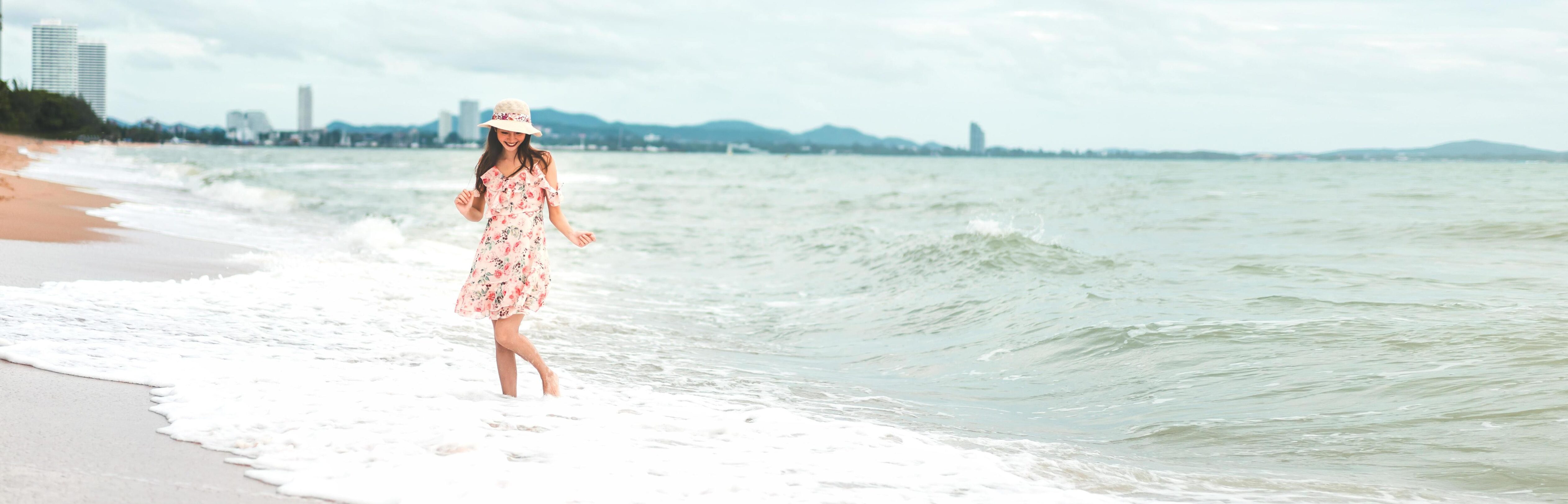 Asian woman relax on the beach Stock Free