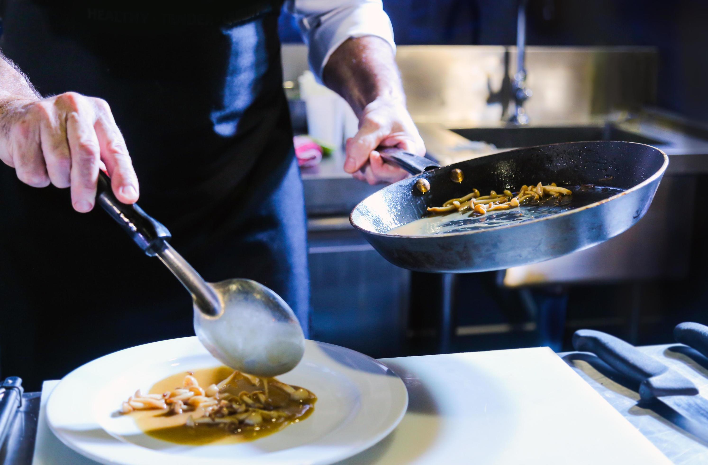 Chef preparing food in the kitchen, chef cooking, closeup Stock Free