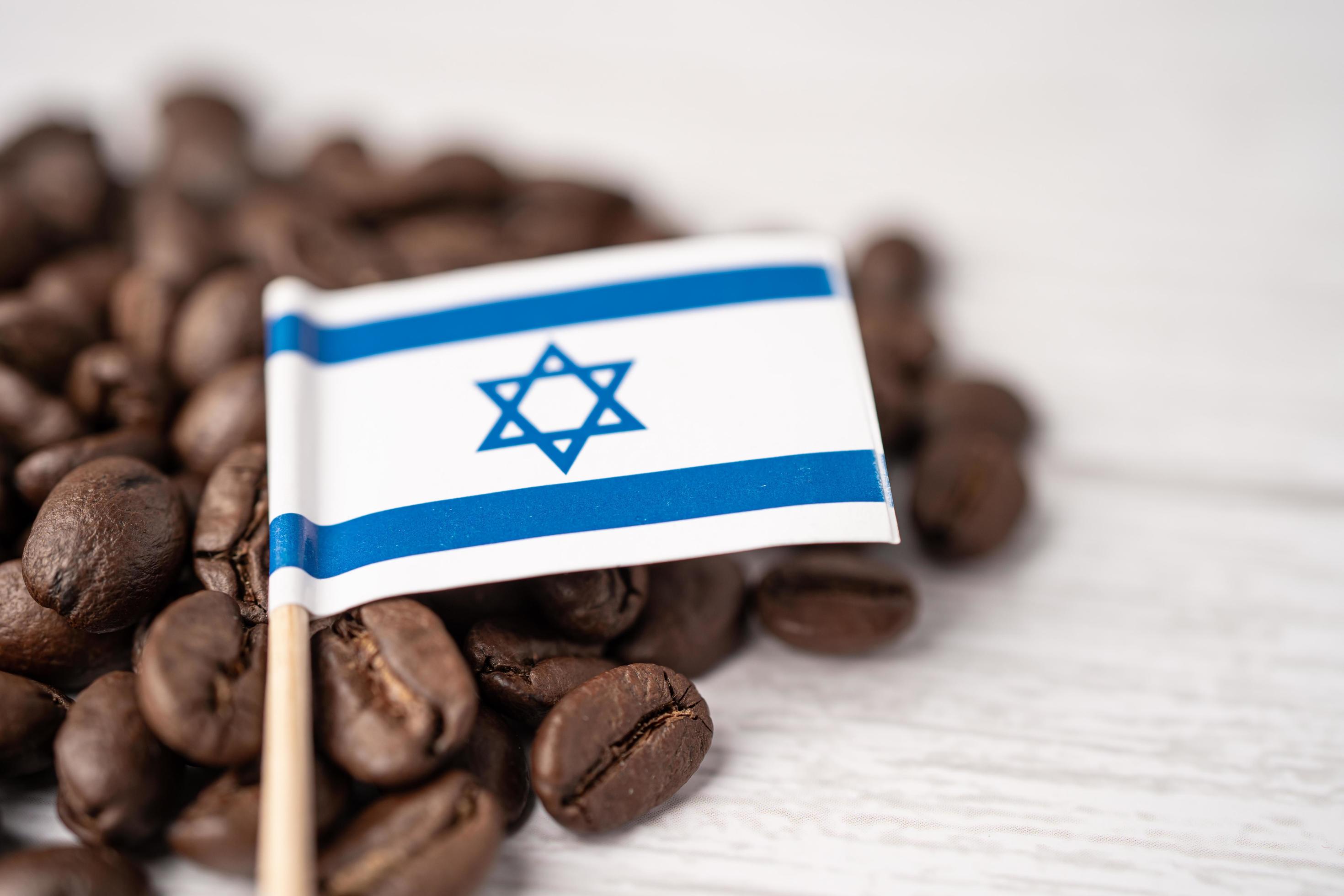 Israel flag on coffee beans, import export drink food concept. Stock Free