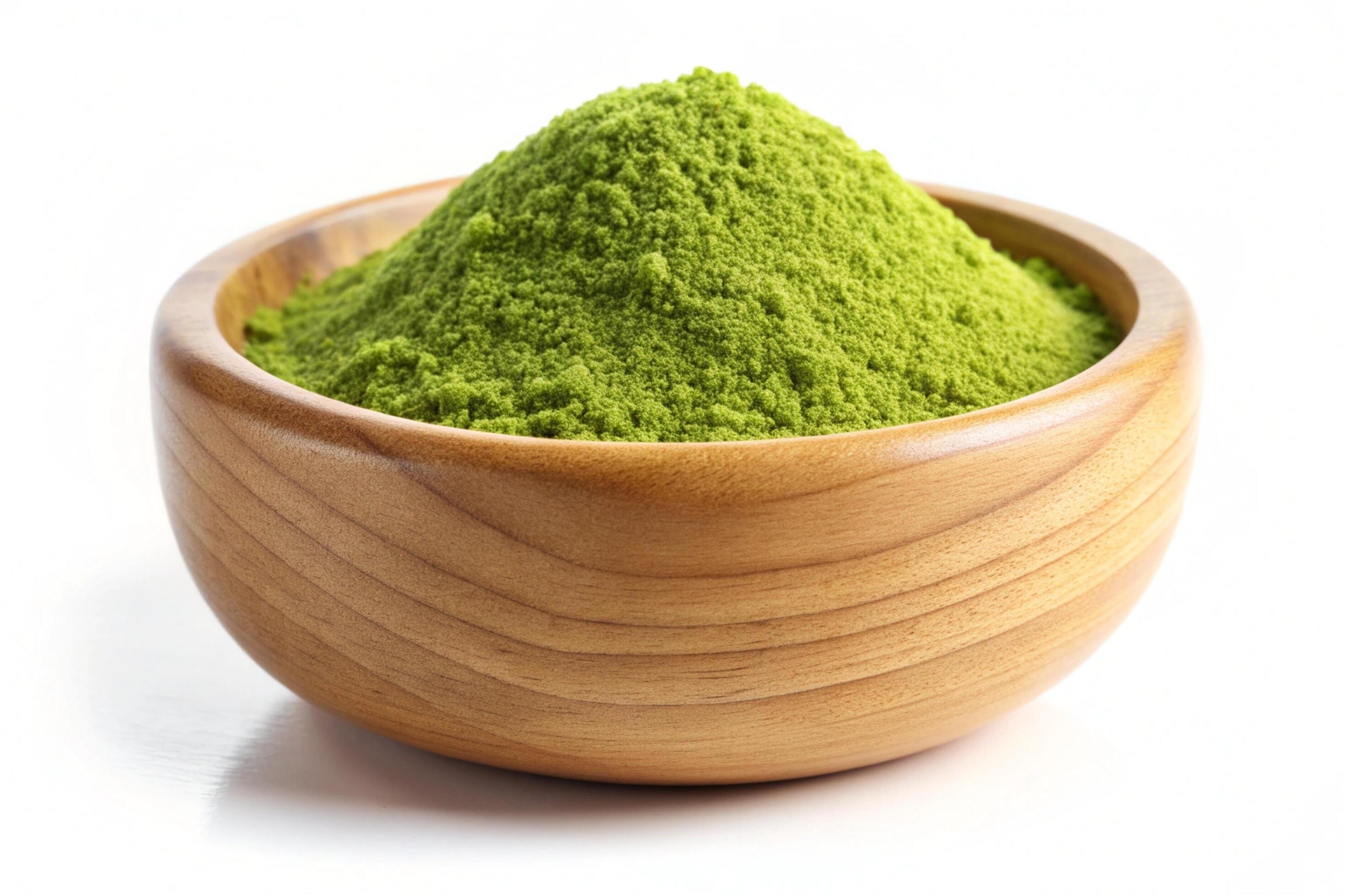 Instant green tea powder in wood bowl isolated on white background Stock Free