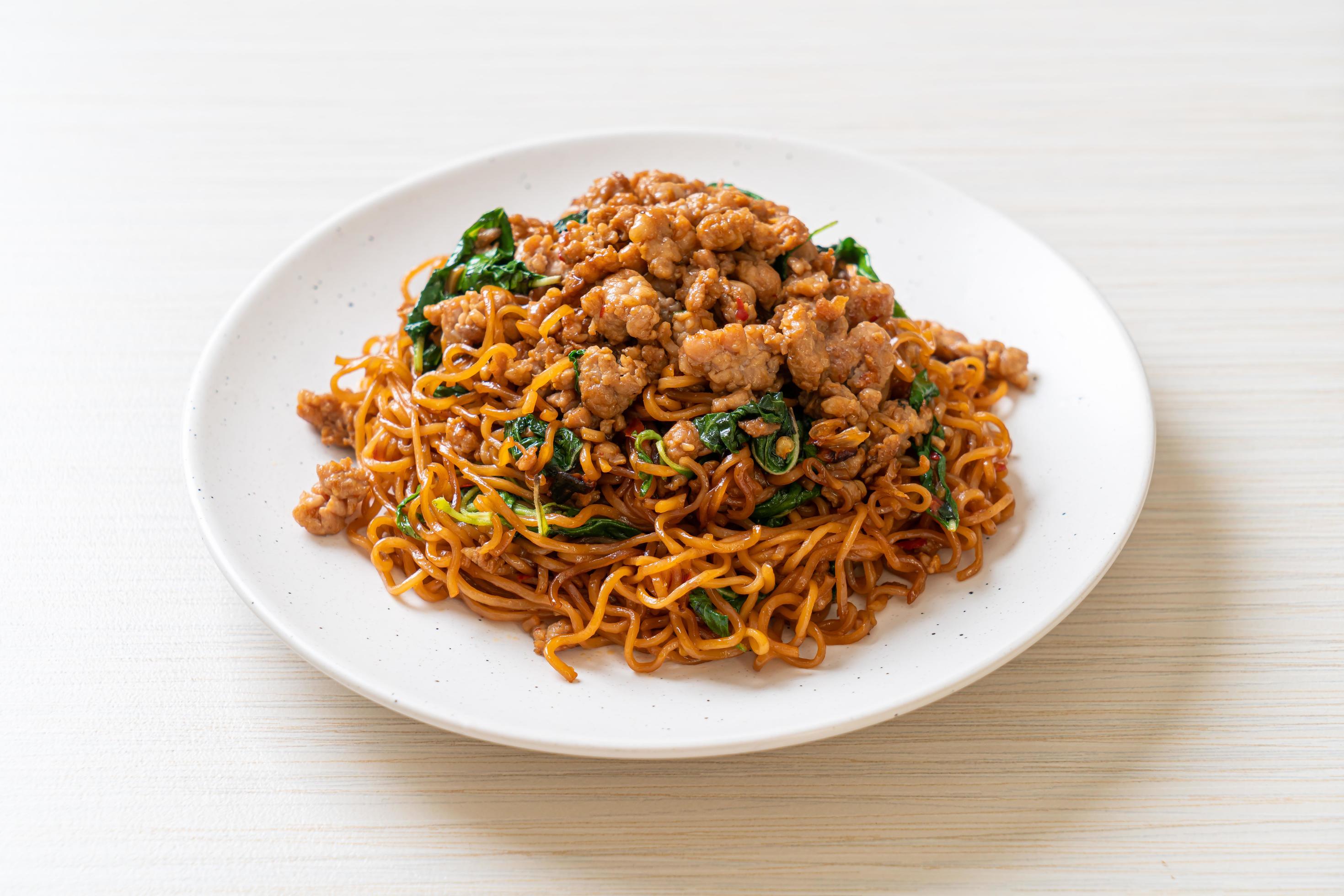 
									Stir-fried instant noodles with Thai basil and minced pork – Asian food style Stock Free