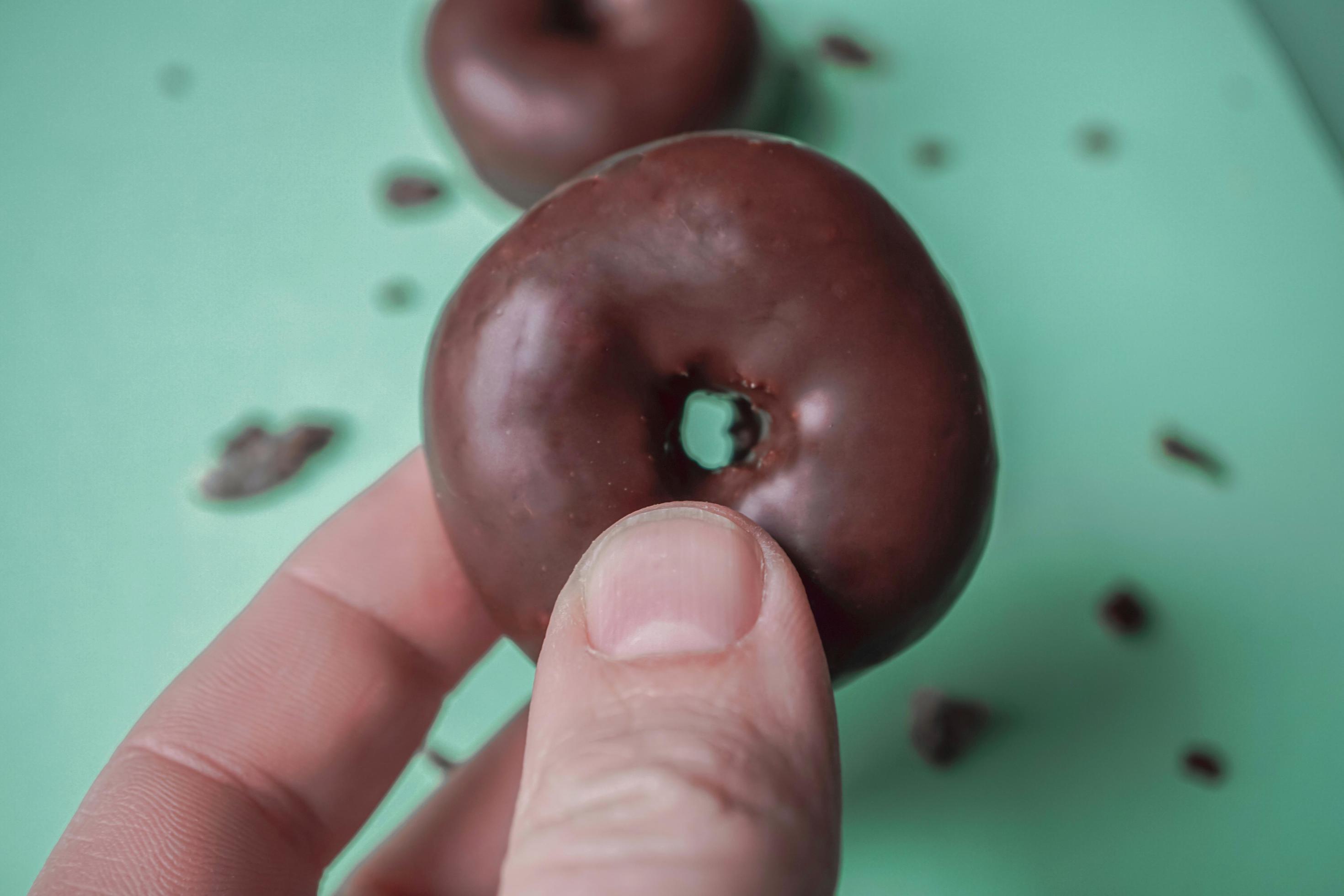 tasty chocolate donut for breakfast, unhealthy food Stock Free