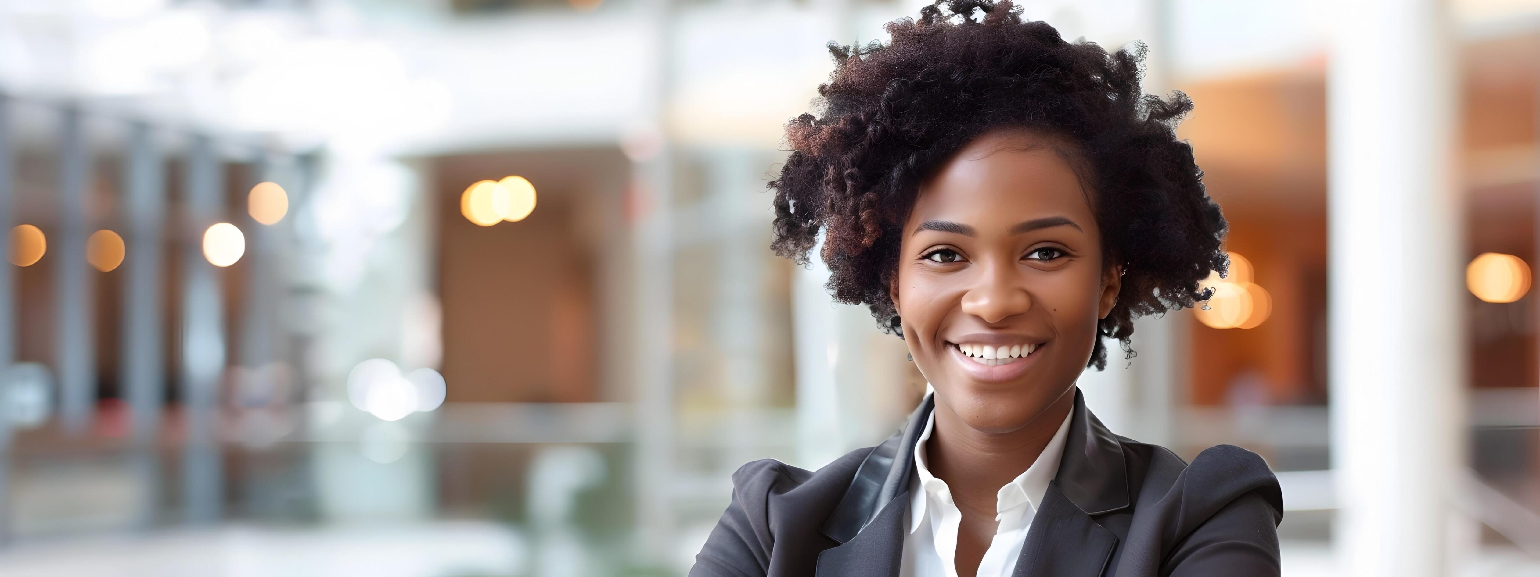 Confident and Successful Young African American Female Businesswoman Smiling in Casual Office Environment Stock Free