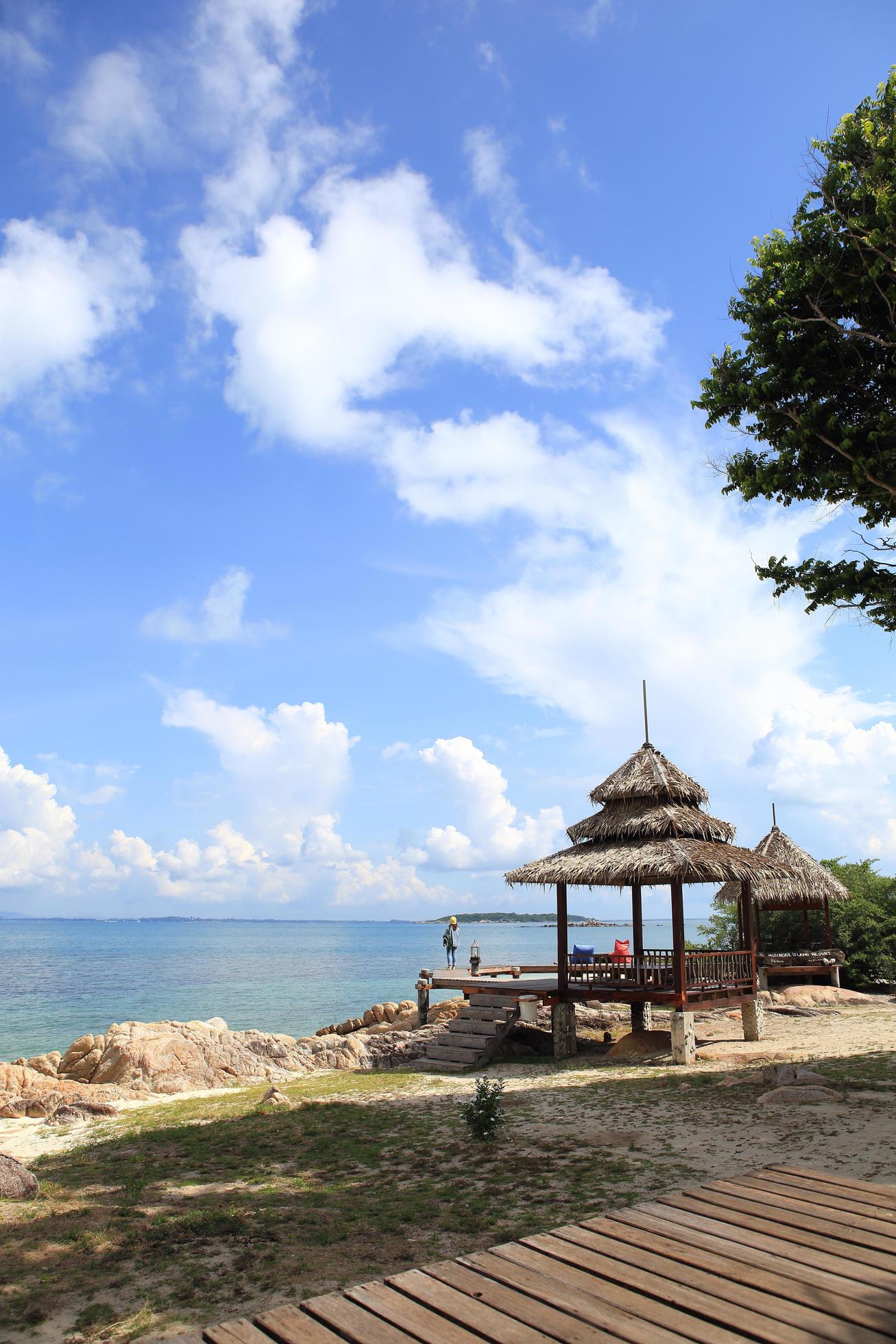 Wooden jetty on tropical beach on island Stock Free