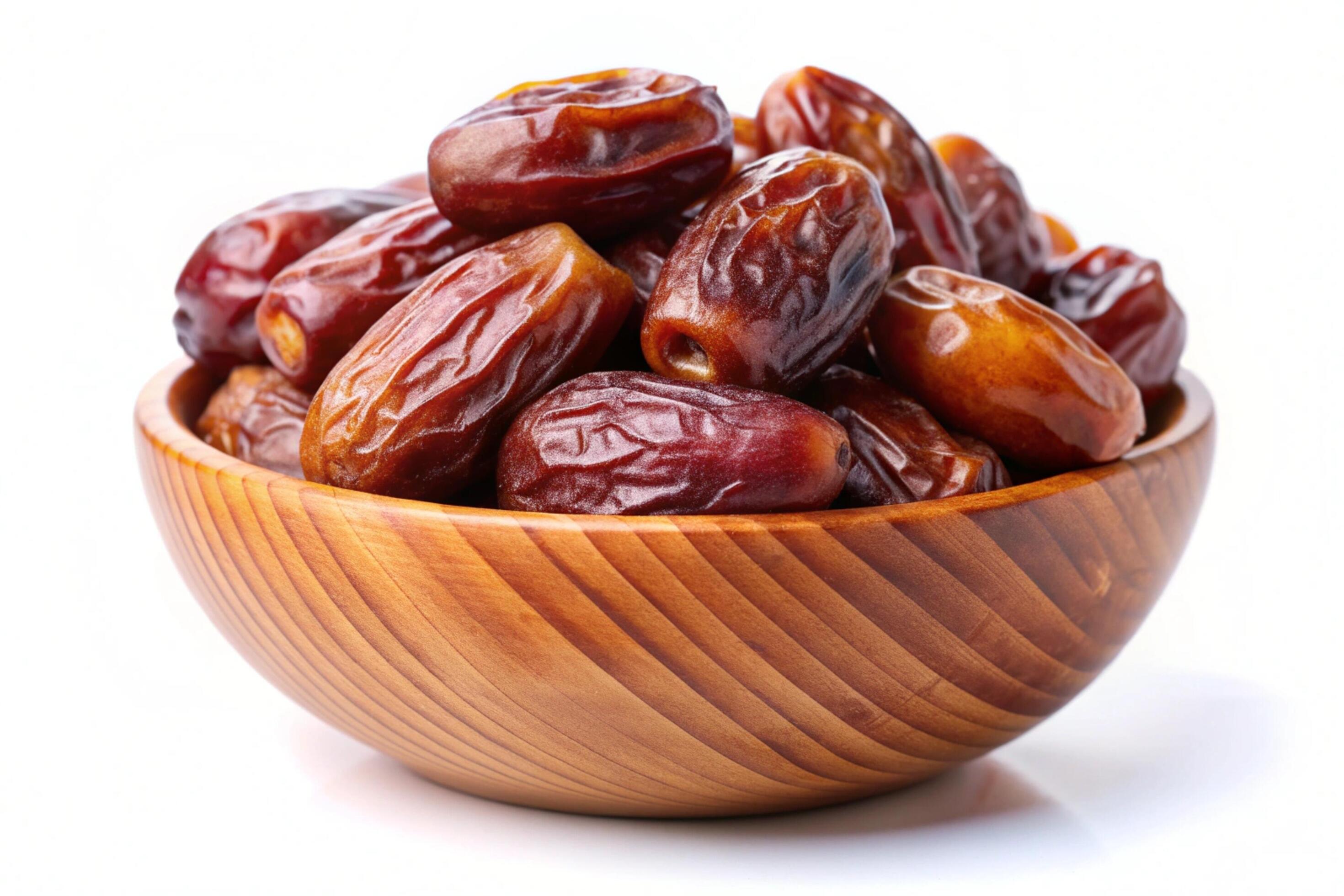 Dates in wood bowl isolated on white background Stock Free