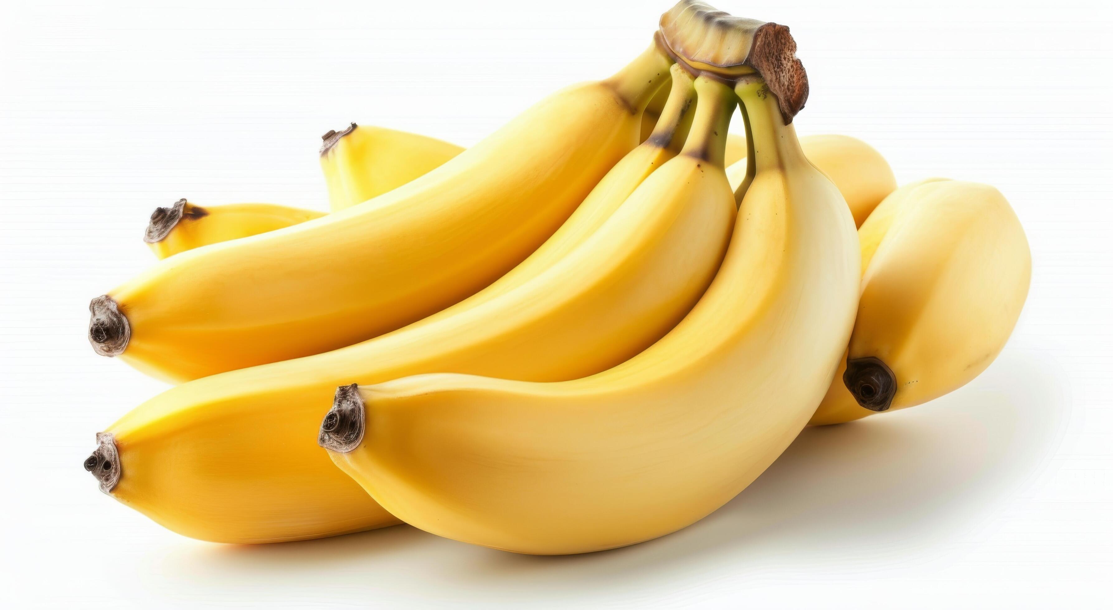 Yellow Bananas Stacked With Sliced Fruit Isolated on White Background Stock Free