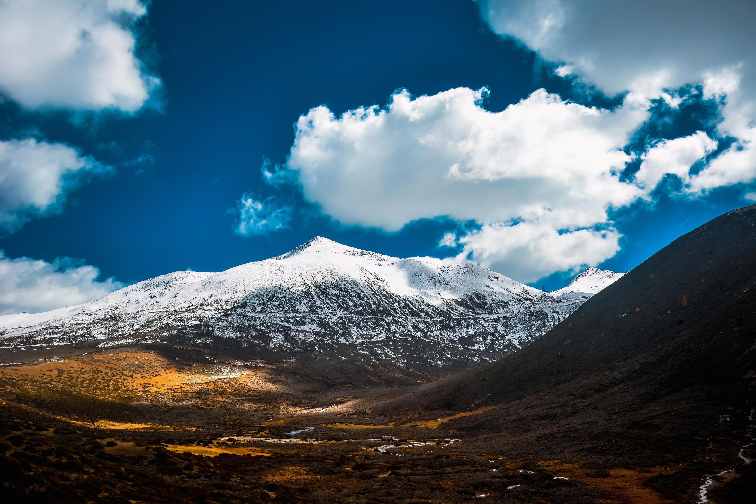 Spectacular scenery in the high mountains of western Sichuan, China, with different seasons Stock Free