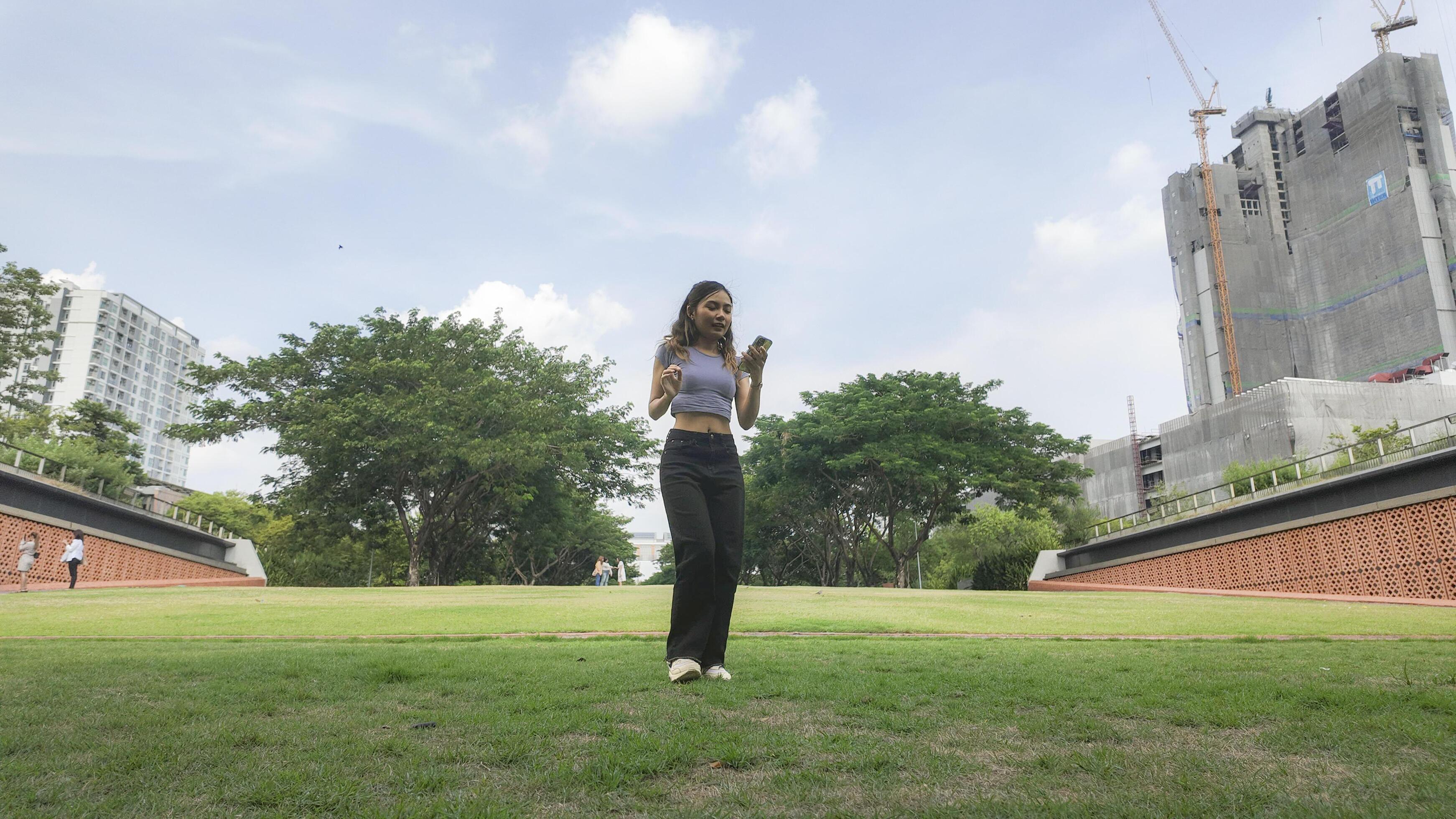 Asian women do freestyle hip hop and breakdancing in a public space in the middle of the city. With a cheerful and happy attitude Stock Free