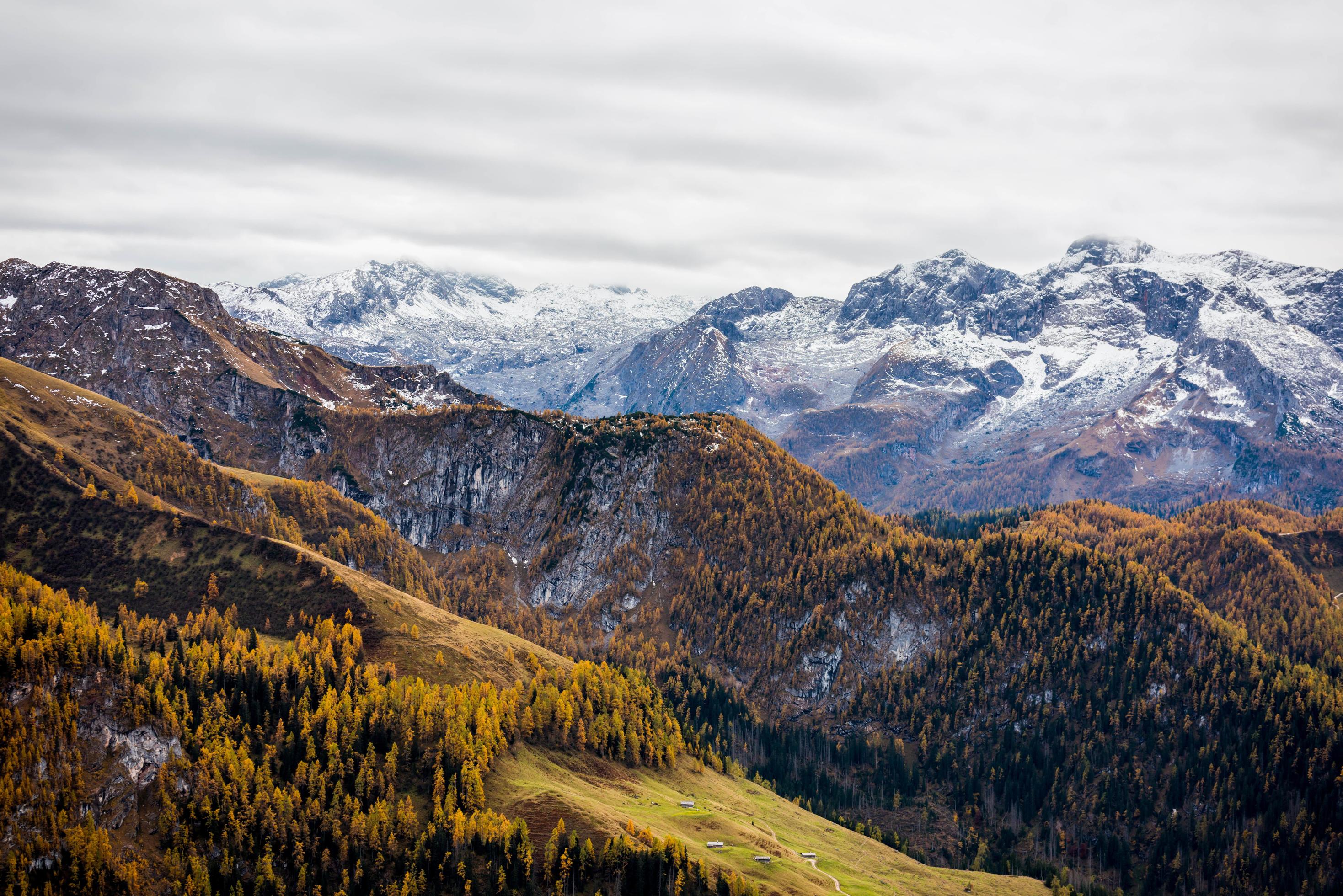 Green and brown mountains under white clouds Stock Free