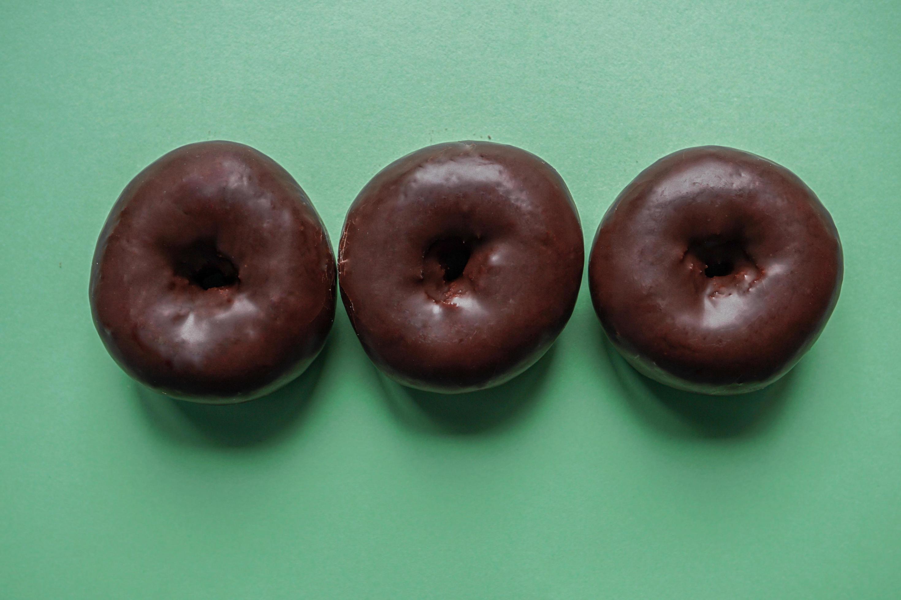 tasty chocolate donuts for breakfast, unhealthy food Stock Free