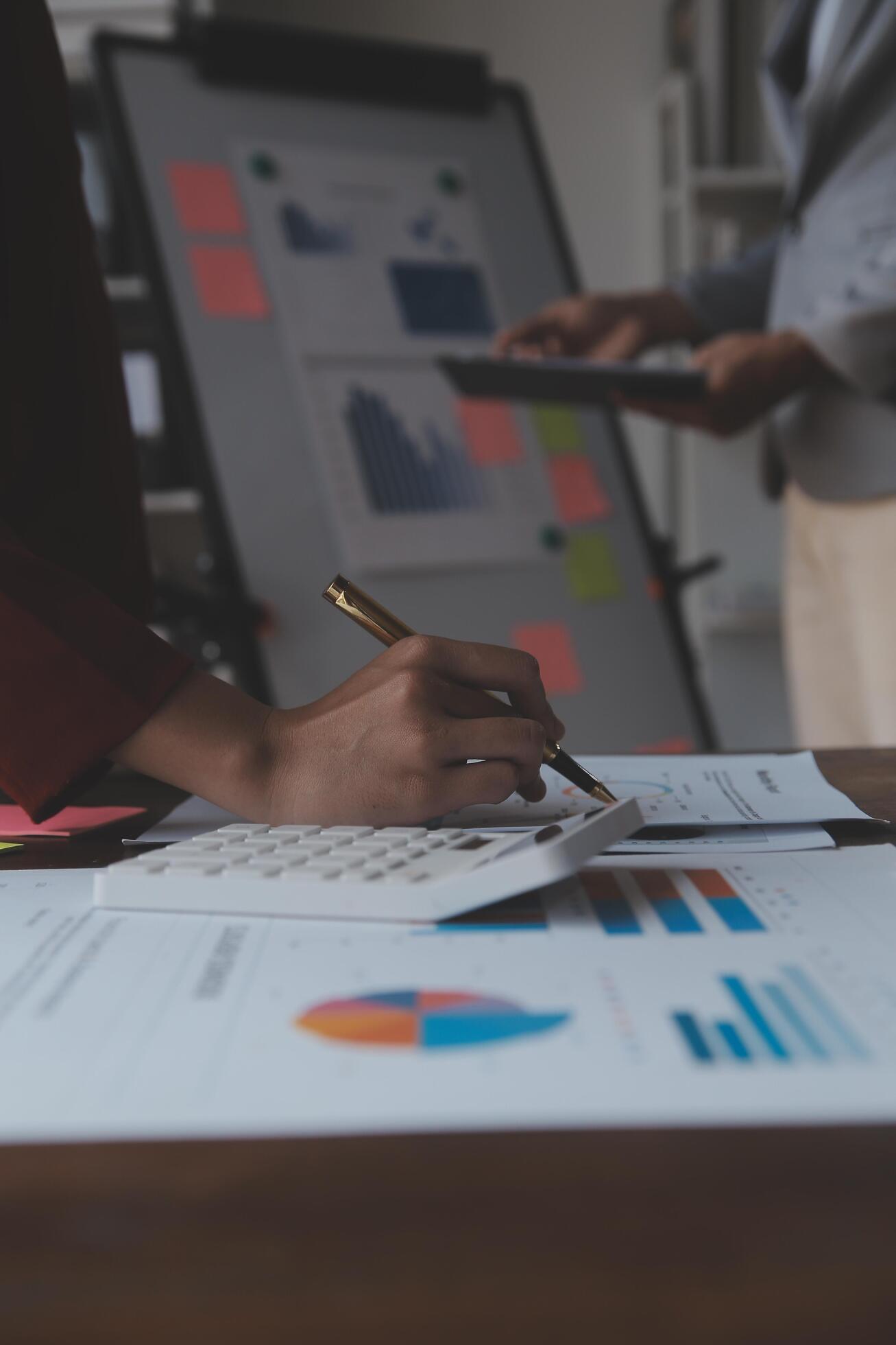 Close up of Business team analyzing income charts and graphs with modern laptop computer. Business analysis and strategy concept. Stock Free