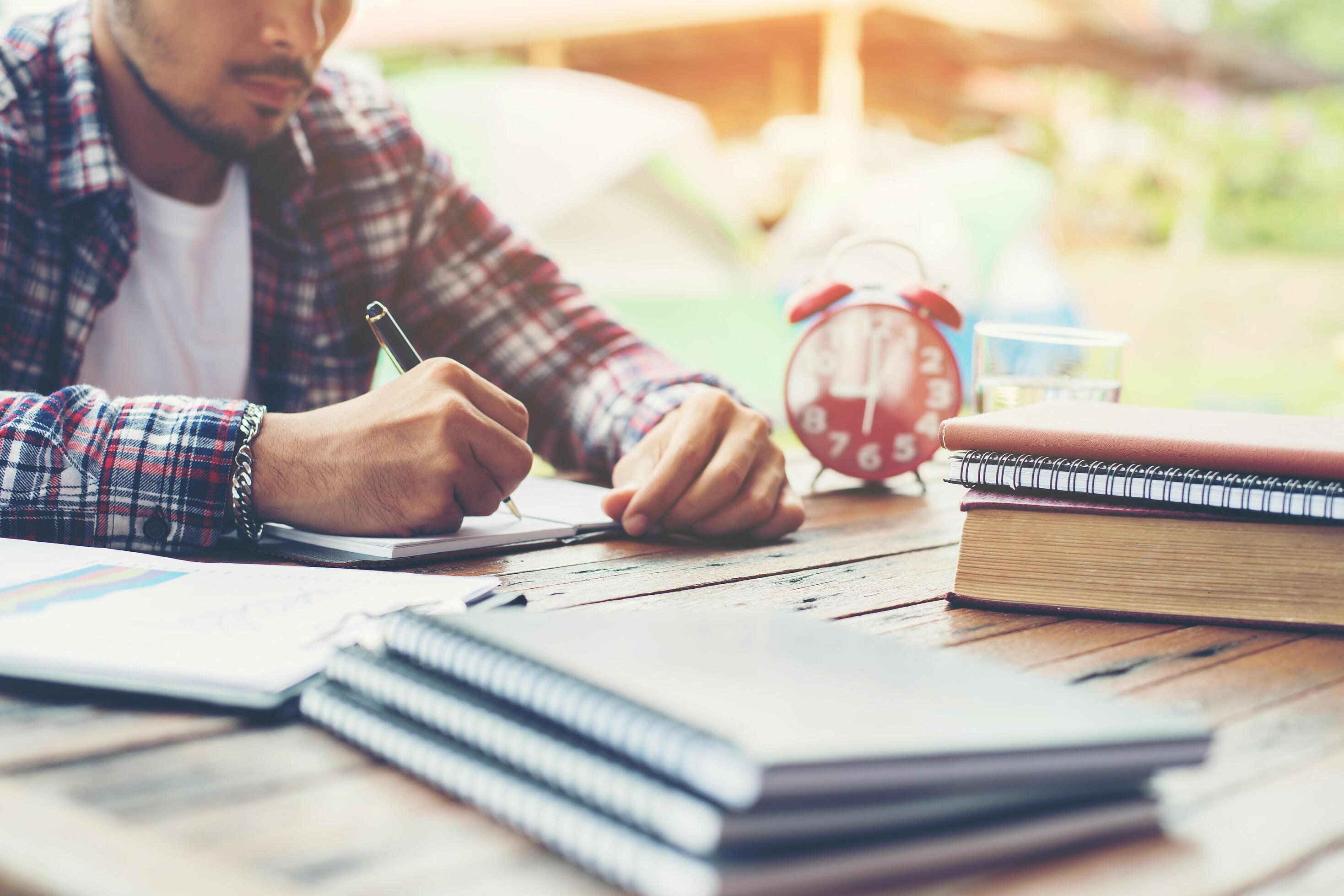 Hipster Businessman Working writing Determine Workspace Lifestyle Concept. Stock Free