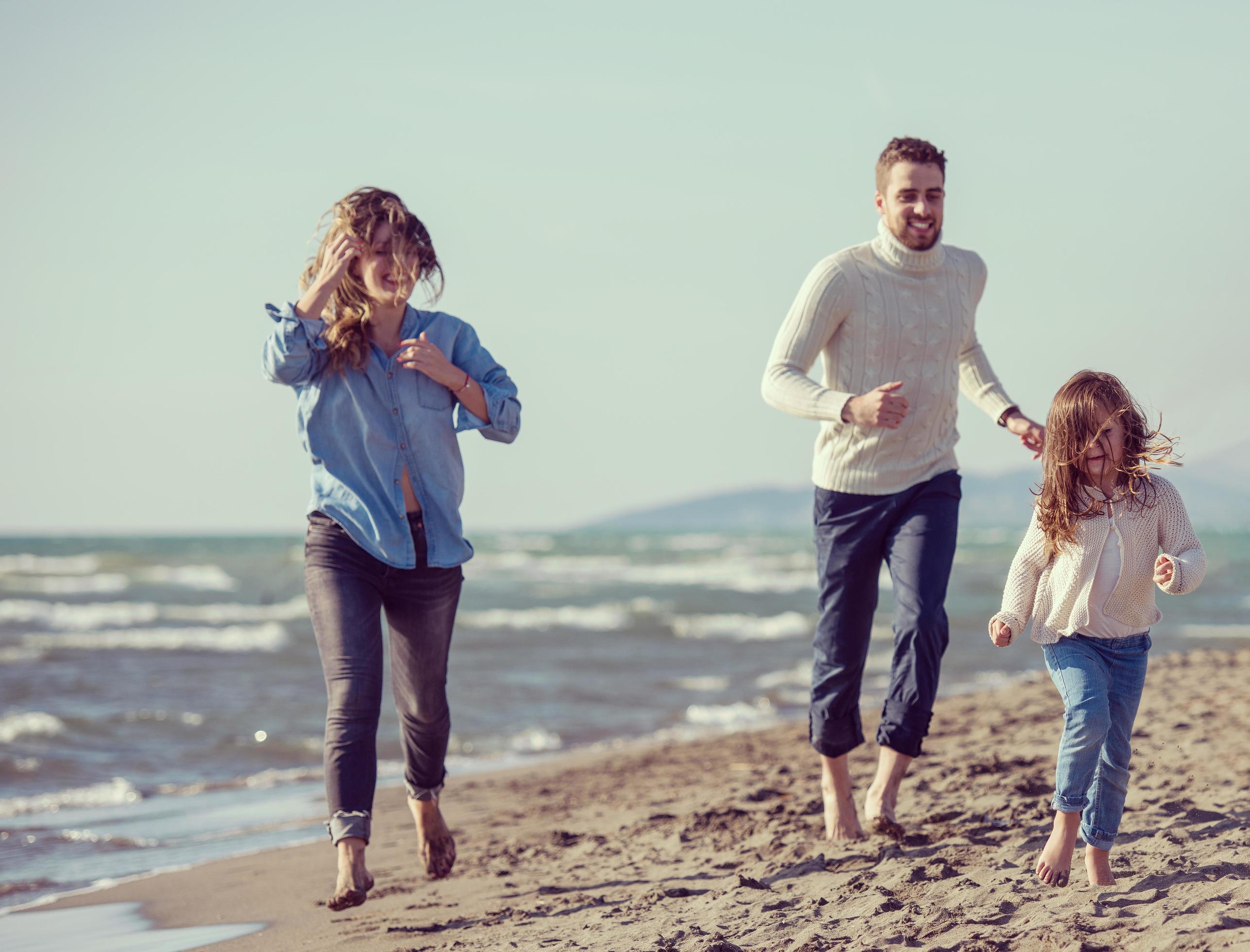 Young family enjoying vecation during autumn Stock Free