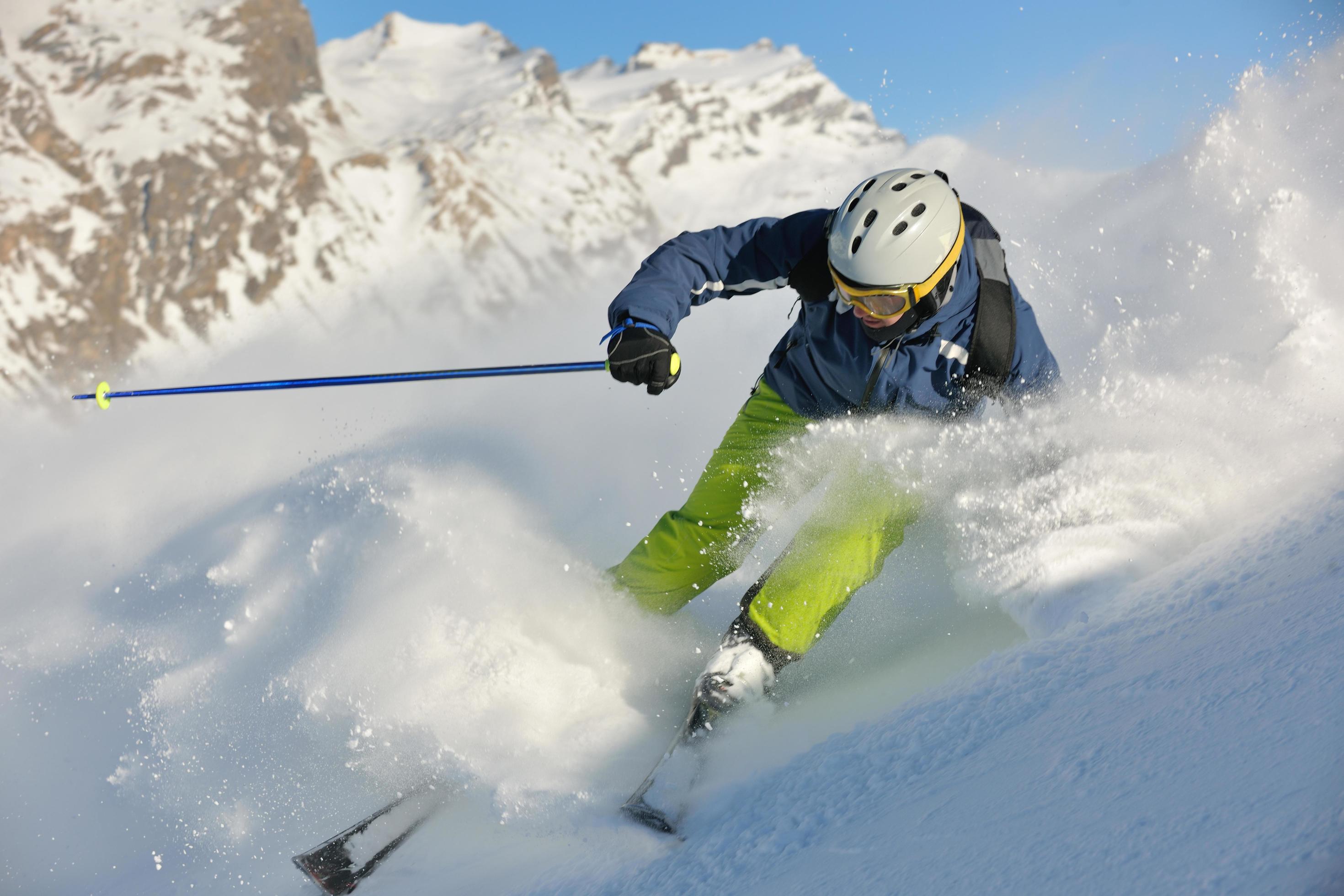 skiing on fresh snow at winter season at beautiful sunny day Stock Free