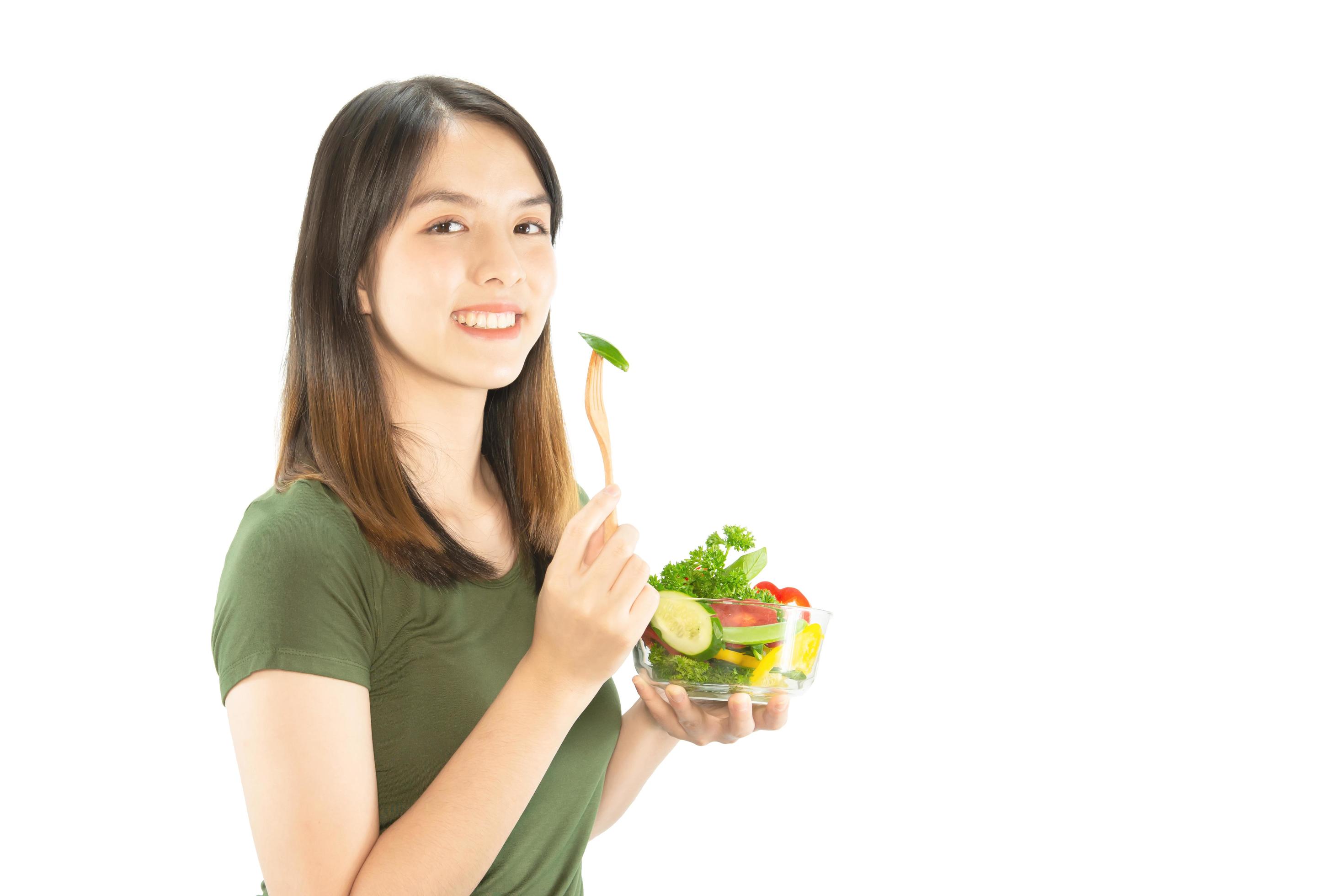 Happy lady holding kichen stuff over copy space background – people home made food preparation concept Stock Free