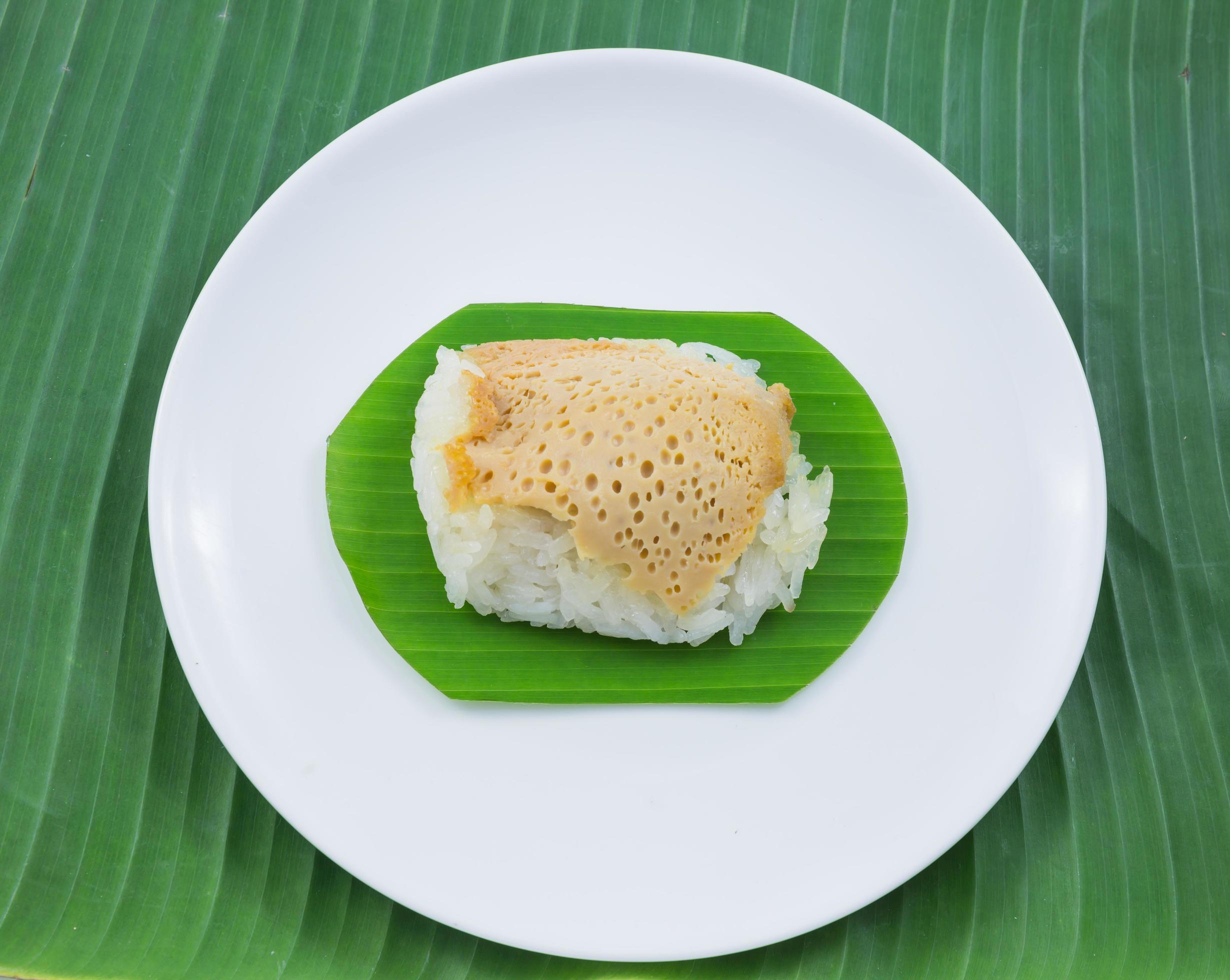 sticky rice with steamed custard on banana leaves and dish, sweet sticky rice, Thai sweet dessert, original Thai food Stock Free