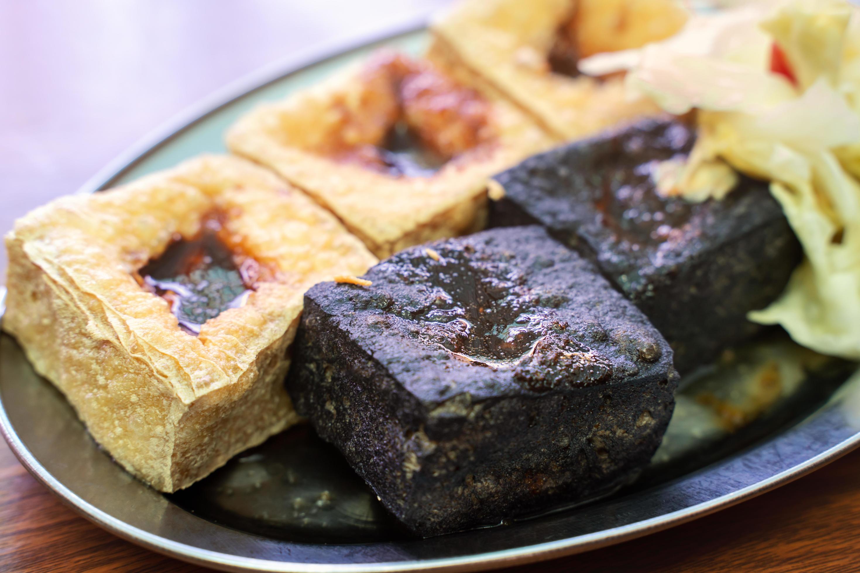 Deep fried stinky tofu with pickled cabbage, famous and delicious street food in Taiwan. Stock Free