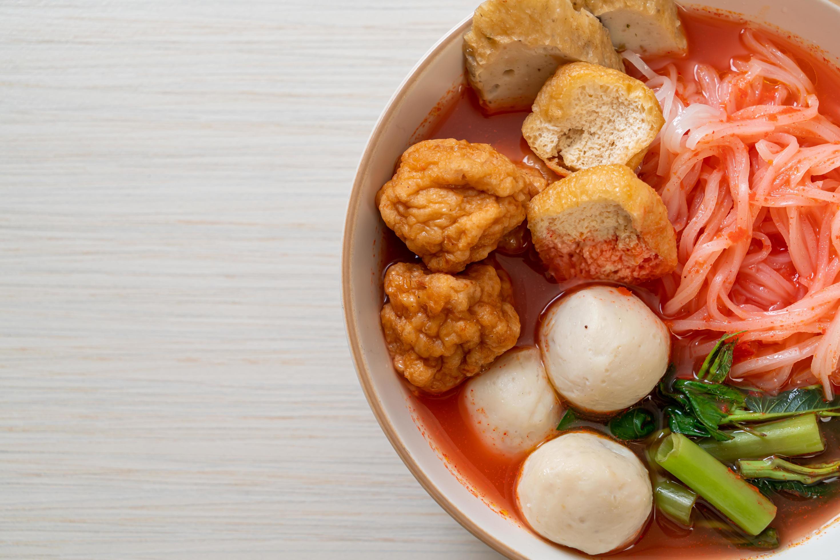 Small flat rice noodles with fish balls and shrimp balls in pink soup, Yen Ta Four or Yen Ta Fo – Asian food style Stock Free