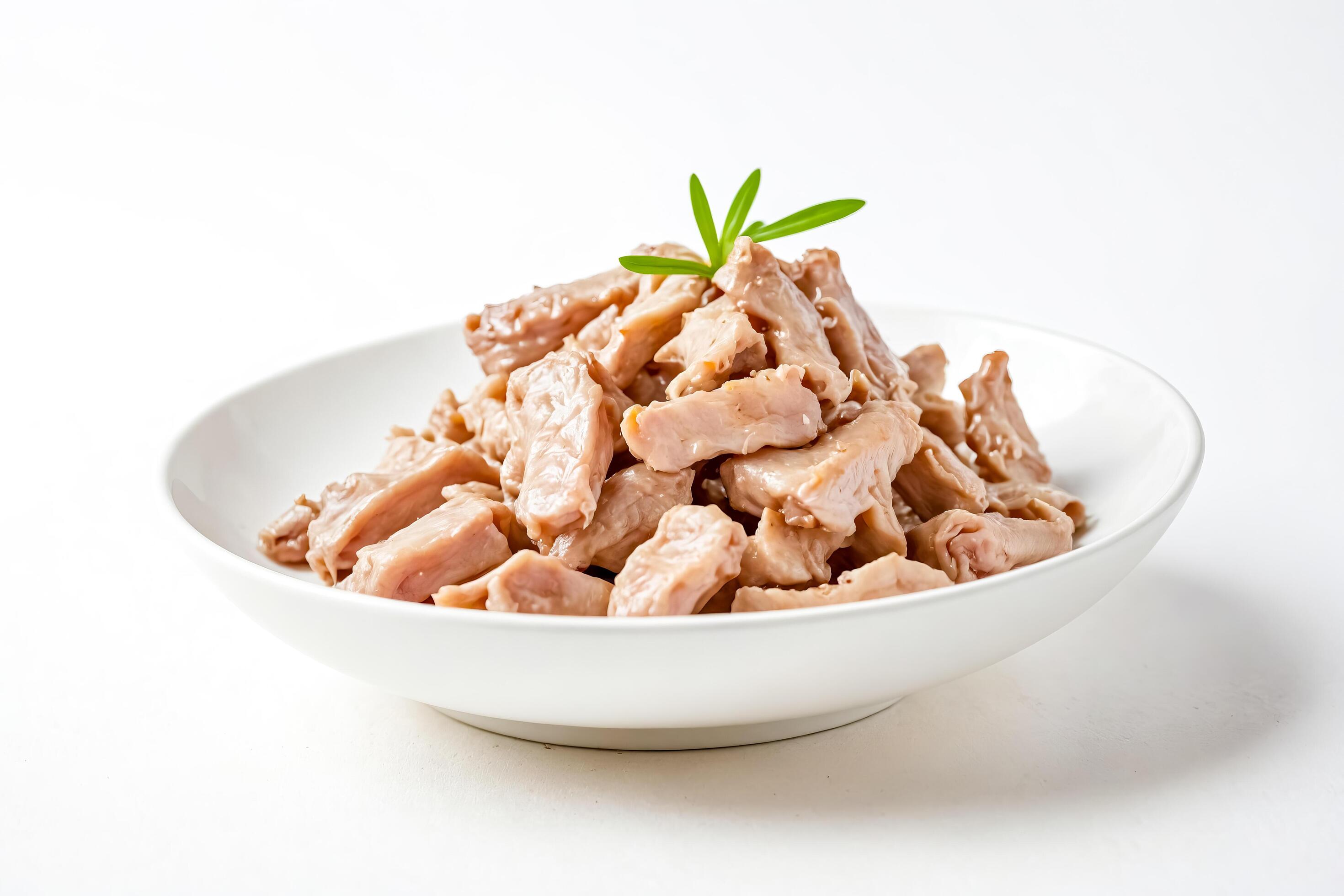 Canned chicken in a white bowl on a white background Stock Free