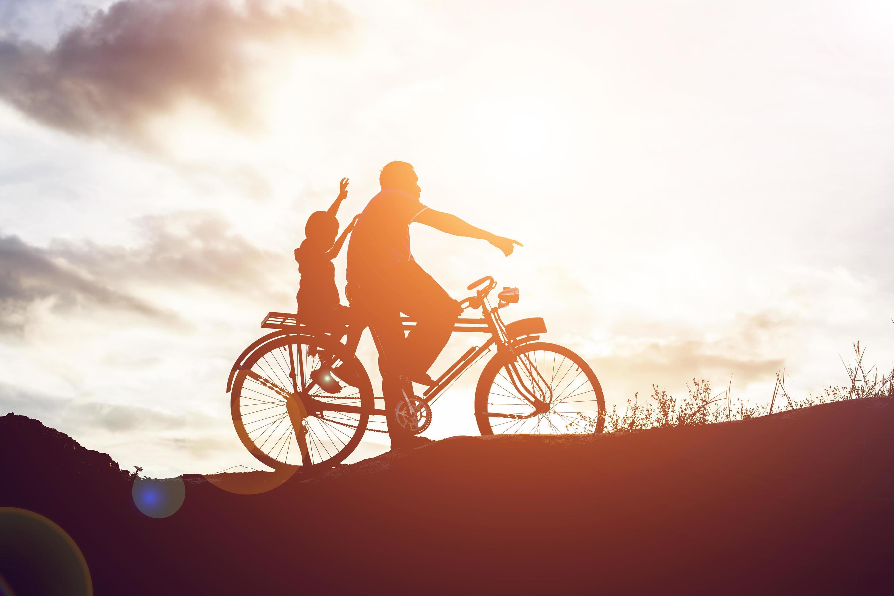 Biker family silhouette father and son Stock Free