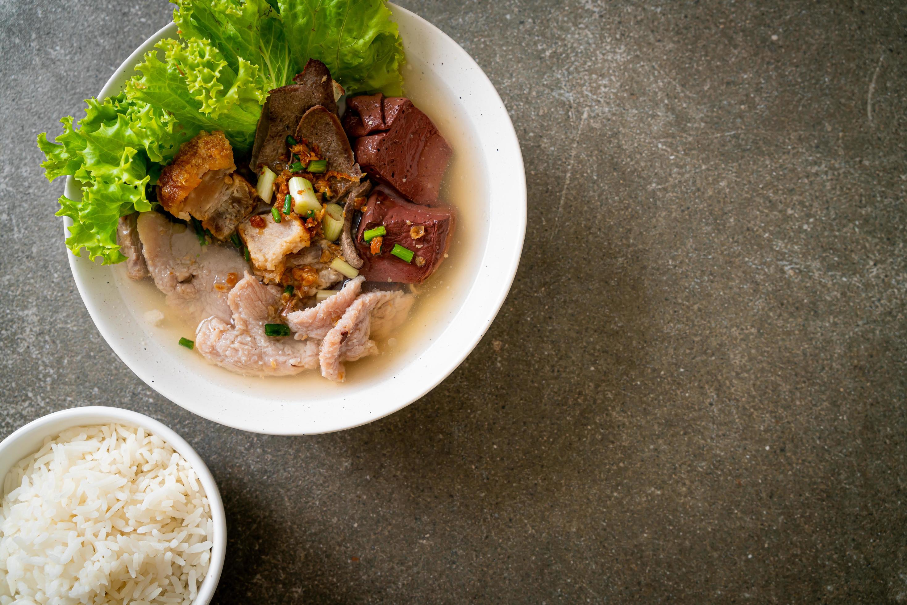 Pork’s entrails and blood jelly soup bowl with rice – Asian food style Stock Free