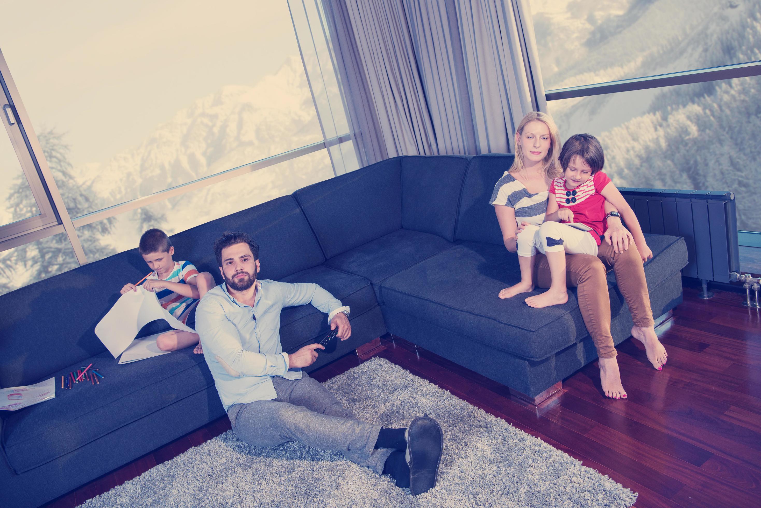 Happy Young Family Playing Together on sofa Stock Free