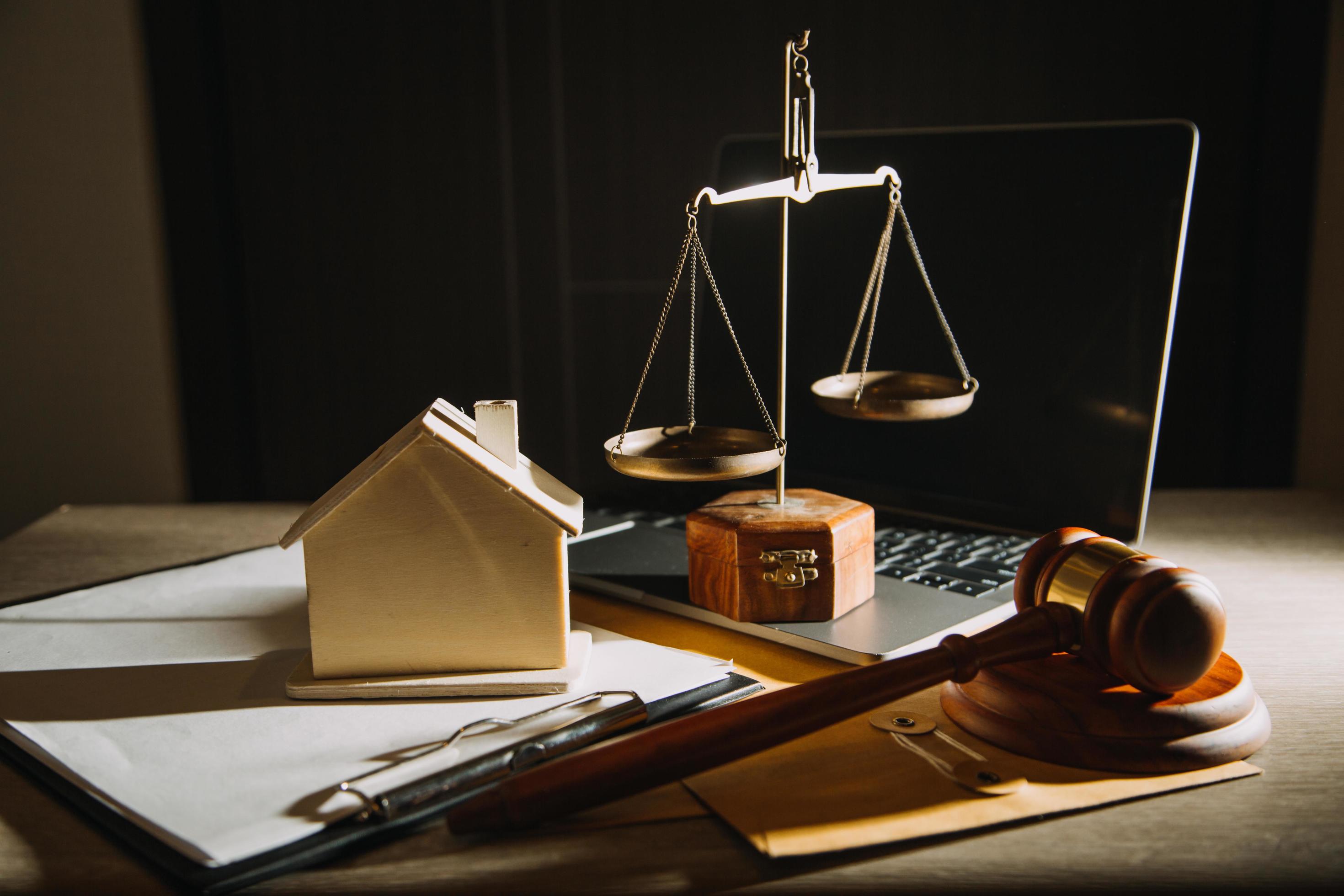 Business and lawyers discussing contract papers with brass scale on desk in office. Law, legal services, advice, justice and law concept Stock Free