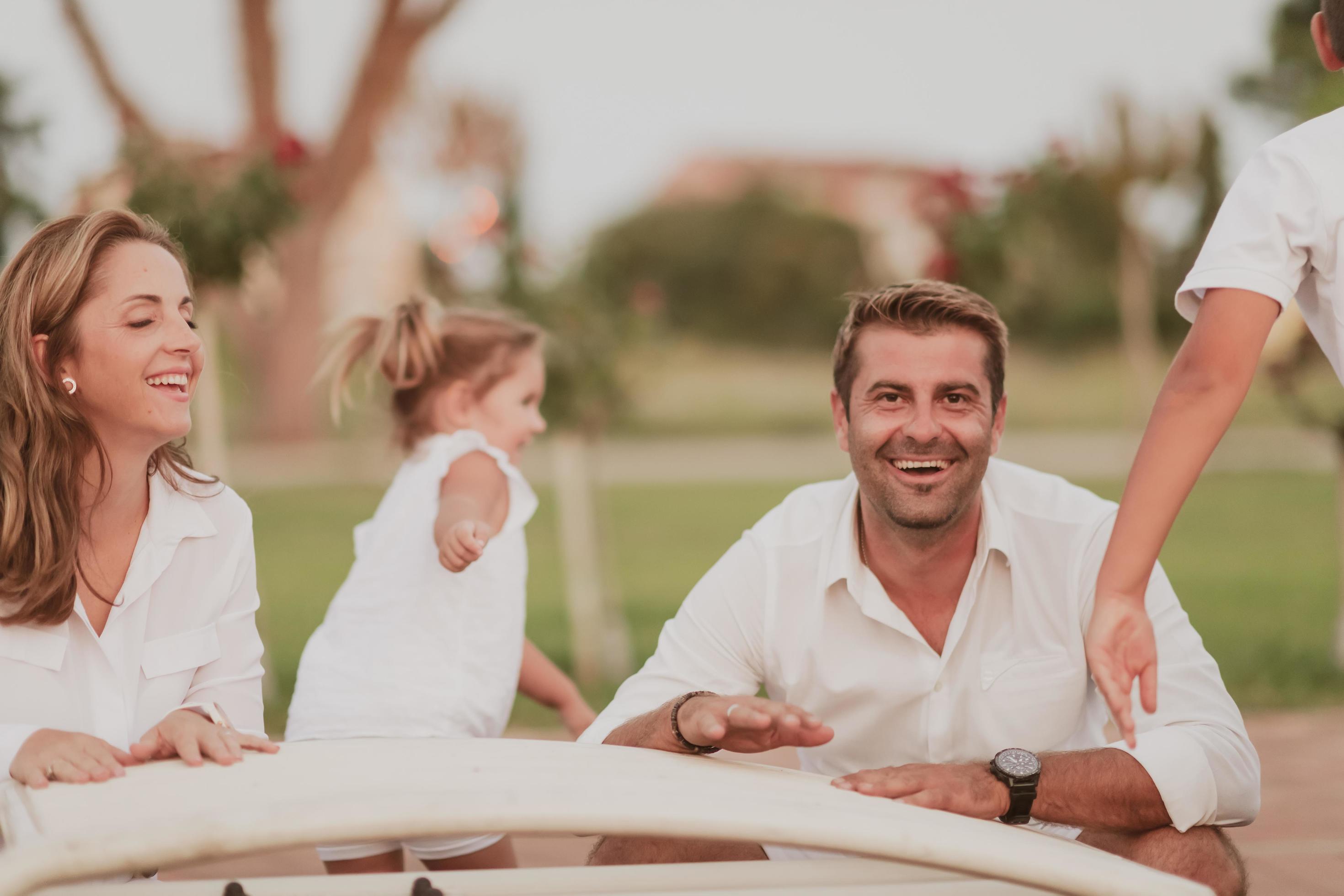 Senior couple in casual clothes with their children spending time in park a vacation together. Family time . Selective focus Stock Free