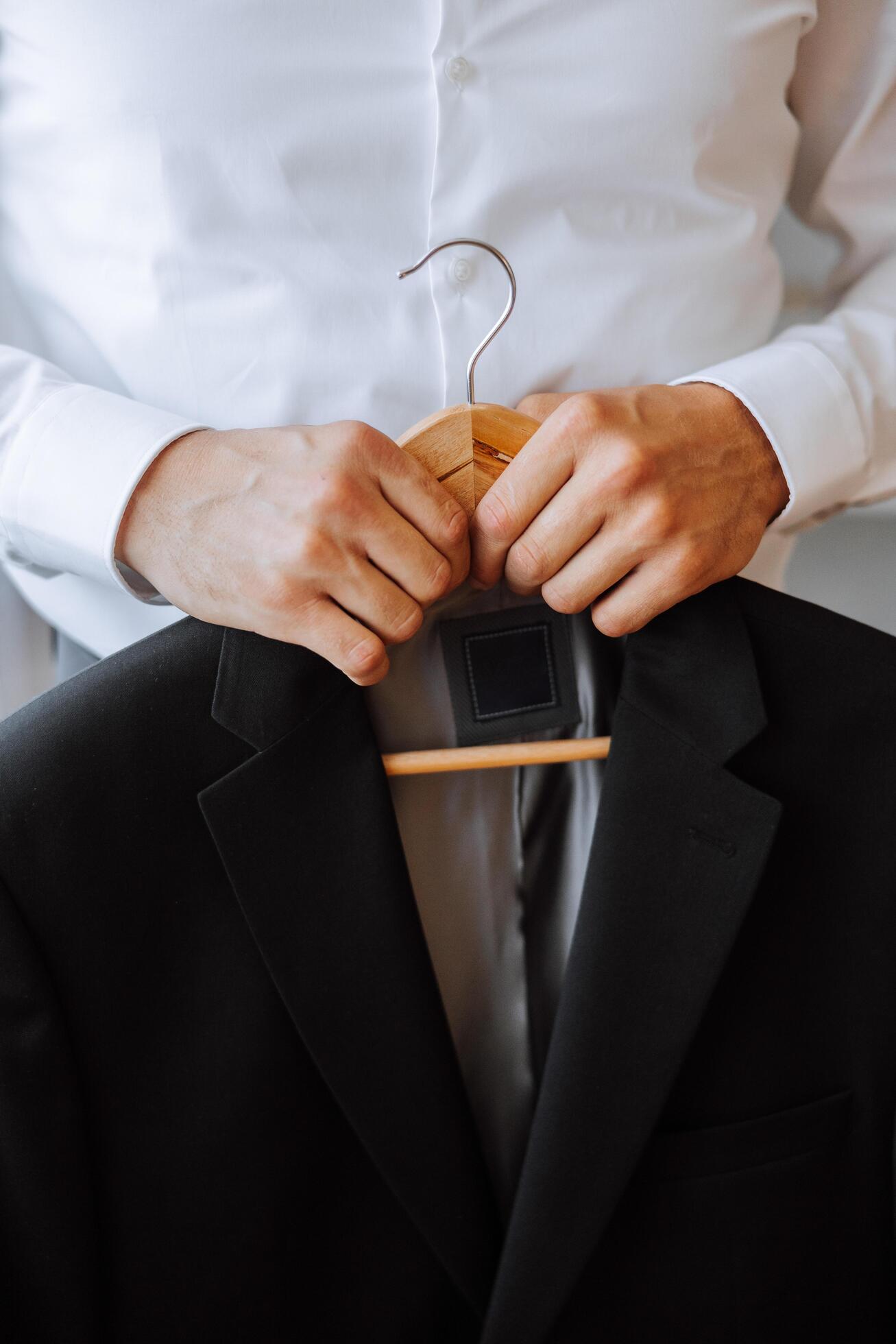 black men’s suit. The man is ready to wear a business suit, white shirt and tie. A black jacket on a mannequin Stock Free