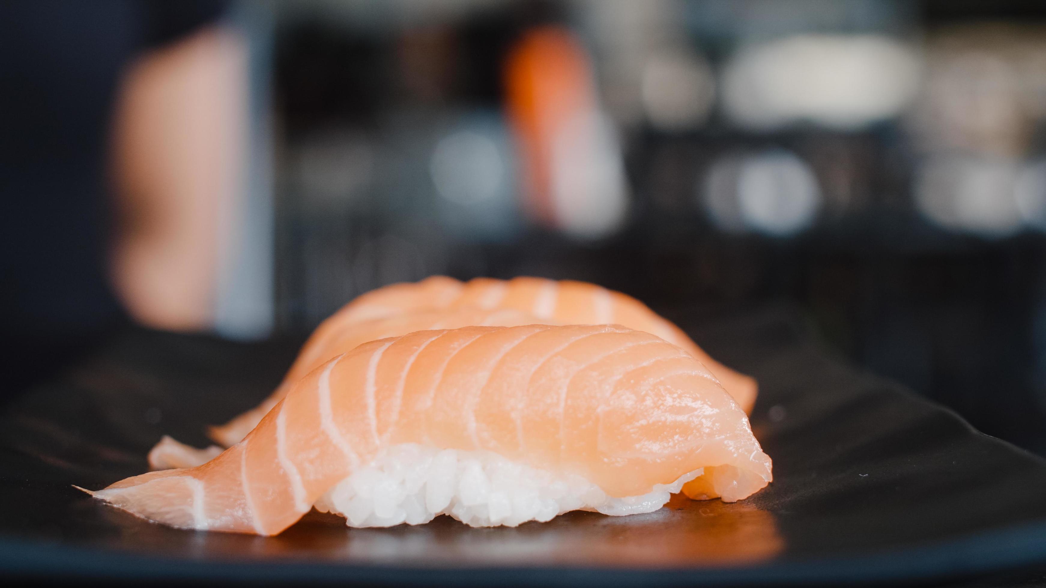 Japanese salmon sushi on plate in Japanese restaurant. Asian Japan traditional food fresh and delicious ingredients. Stock Free