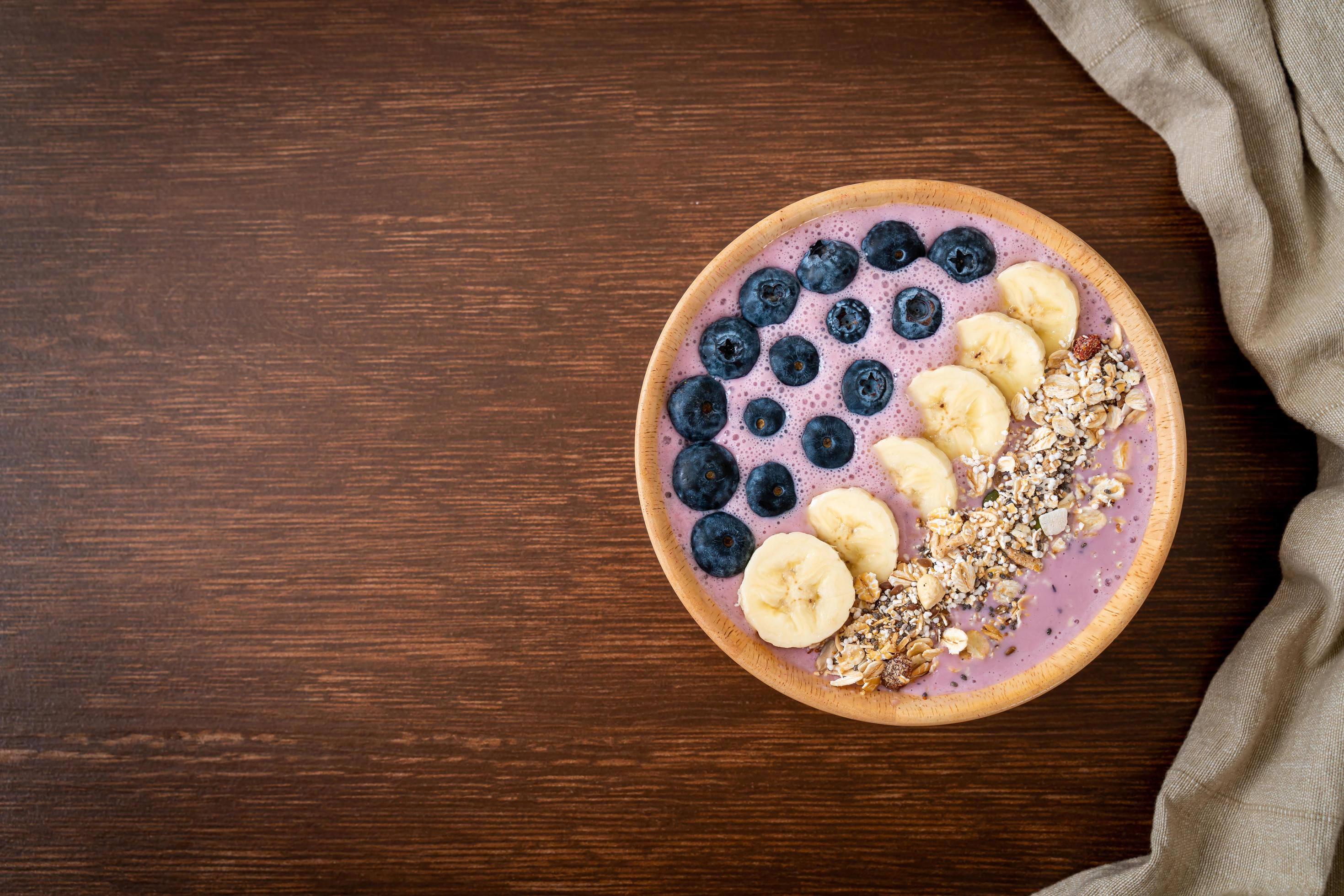 Yogurt or smoothie bowl with blueberry, banana, and granola – Healthy food style Stock Free