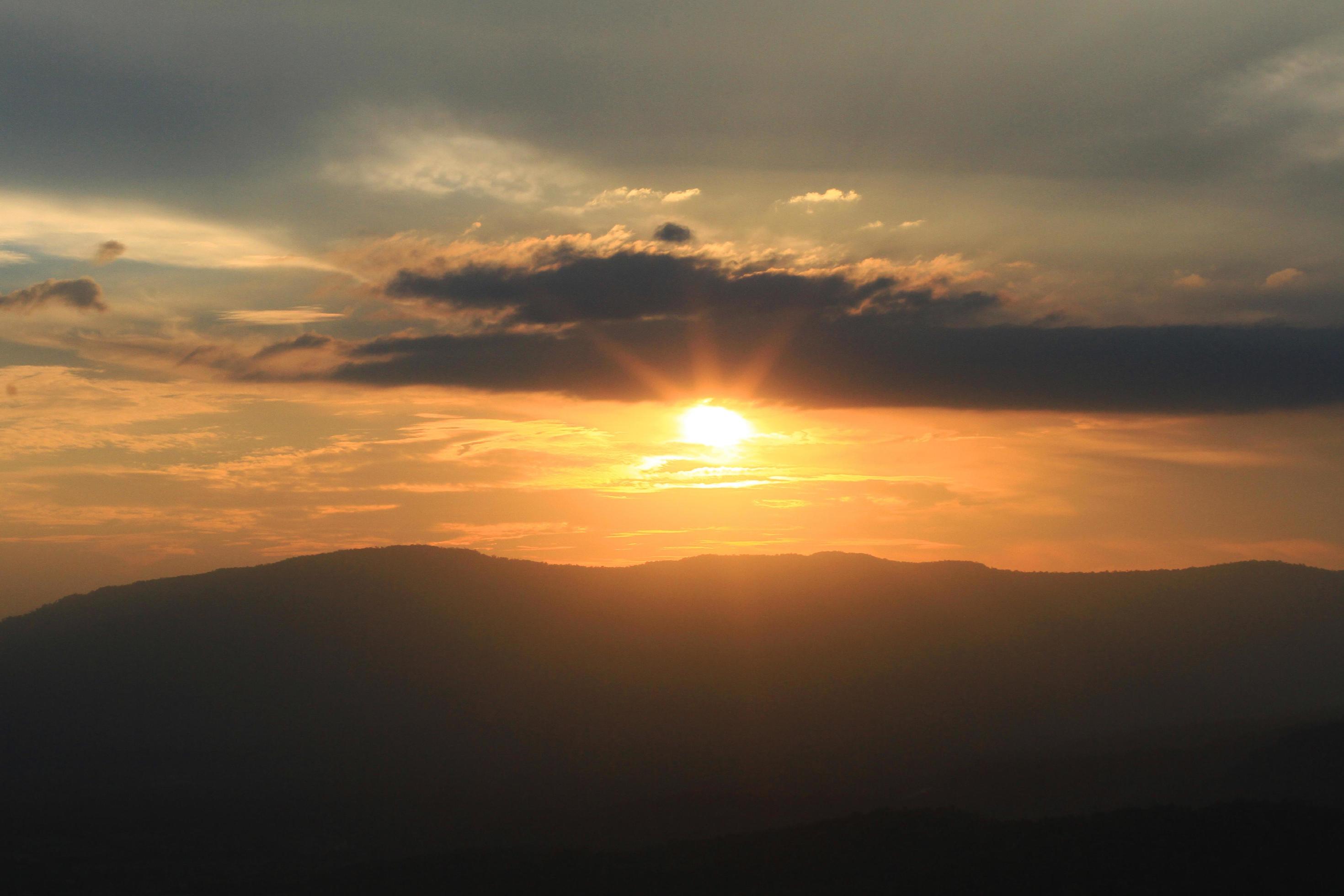 Beautiful landscape layers of mountain and Misty on hill valley in golden twilight of sunset at Thailand Stock Free